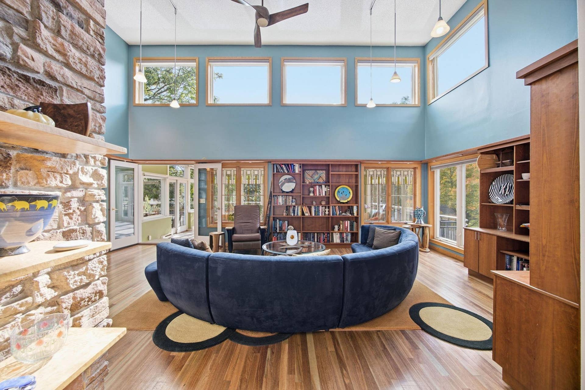 4- "Dramatic two-story great room with custom cherry built-ins, transom windows, and abundant natural light."