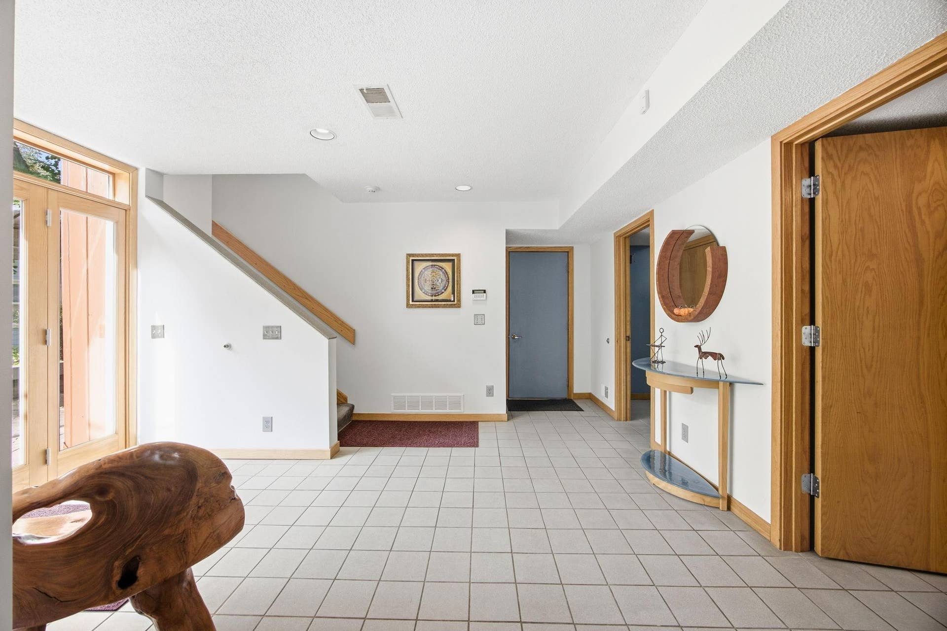 31-   Large tiled entry with side access and garage access.