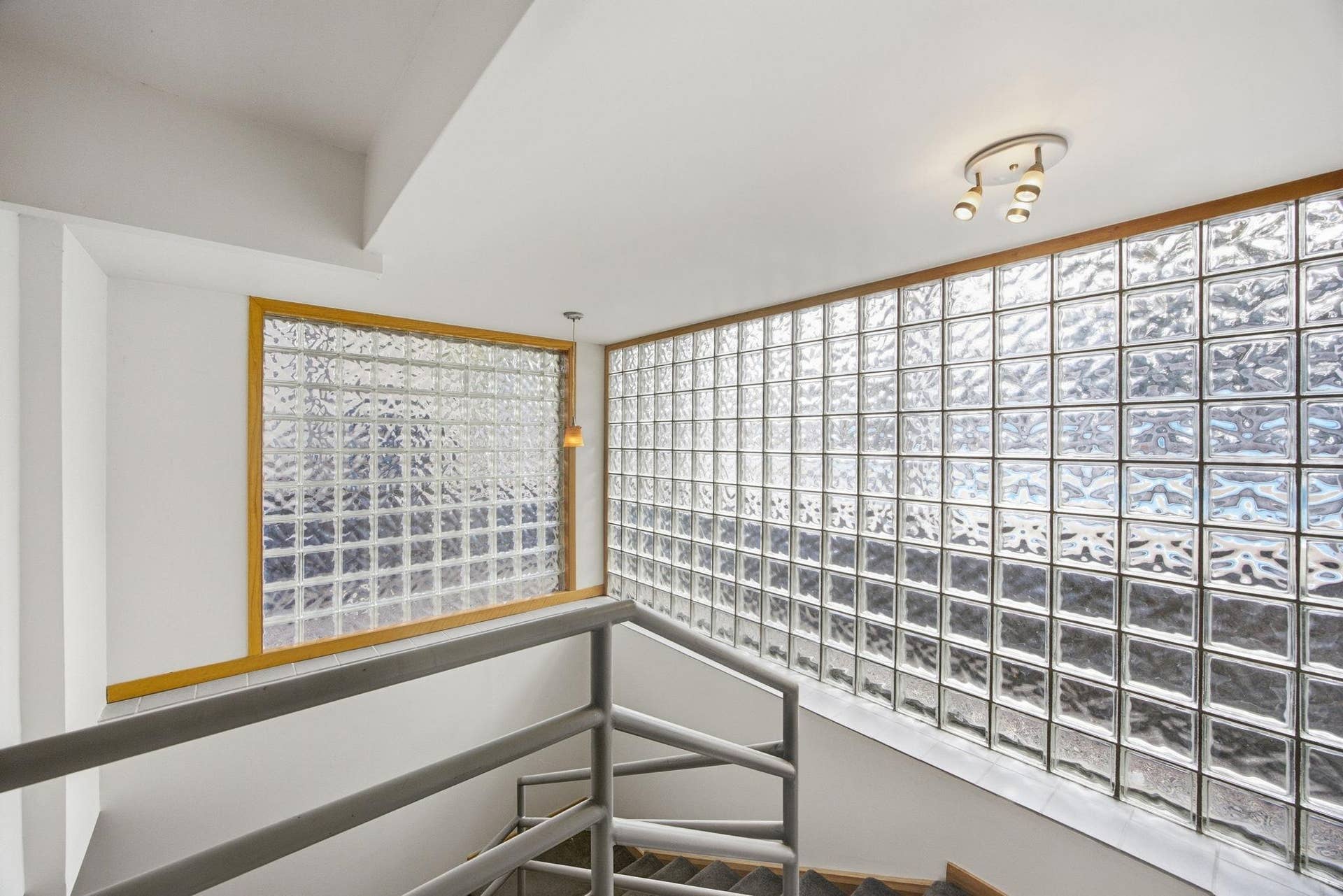 42  Unique glass block encased stairwell to the basement.