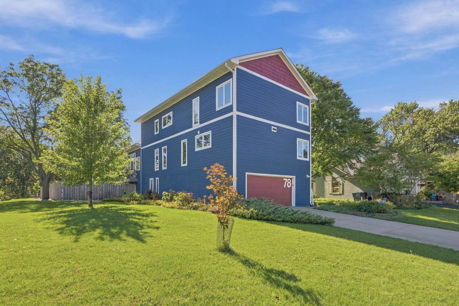 Architecturally distinctive three-story home with a finished basement, extensive updates, and a private fenced pool area designed for entertaining and recreation.