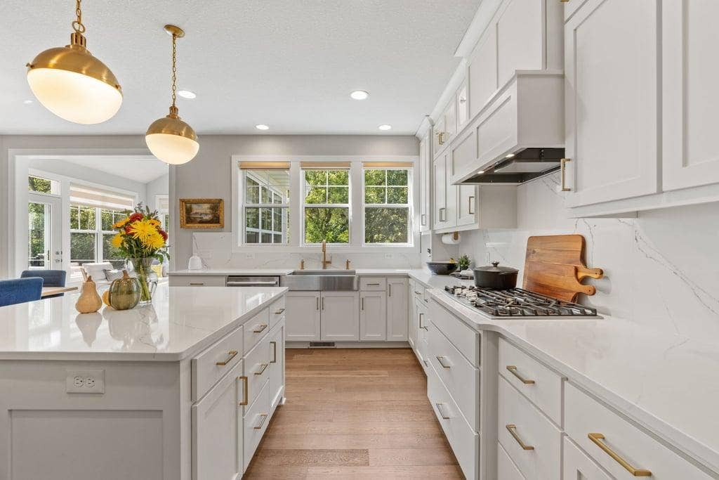 Storage space galore in this custom-designed kitchen. Note the kitchen sink which overlooks the private-wooded backyard.