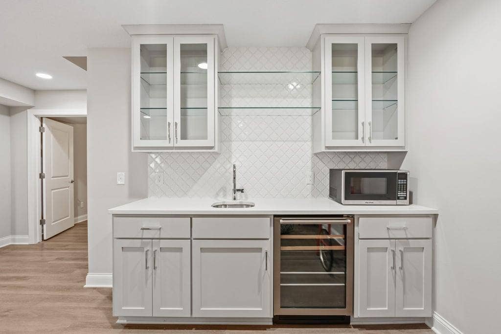 Custom built-in wet bar in lower level.