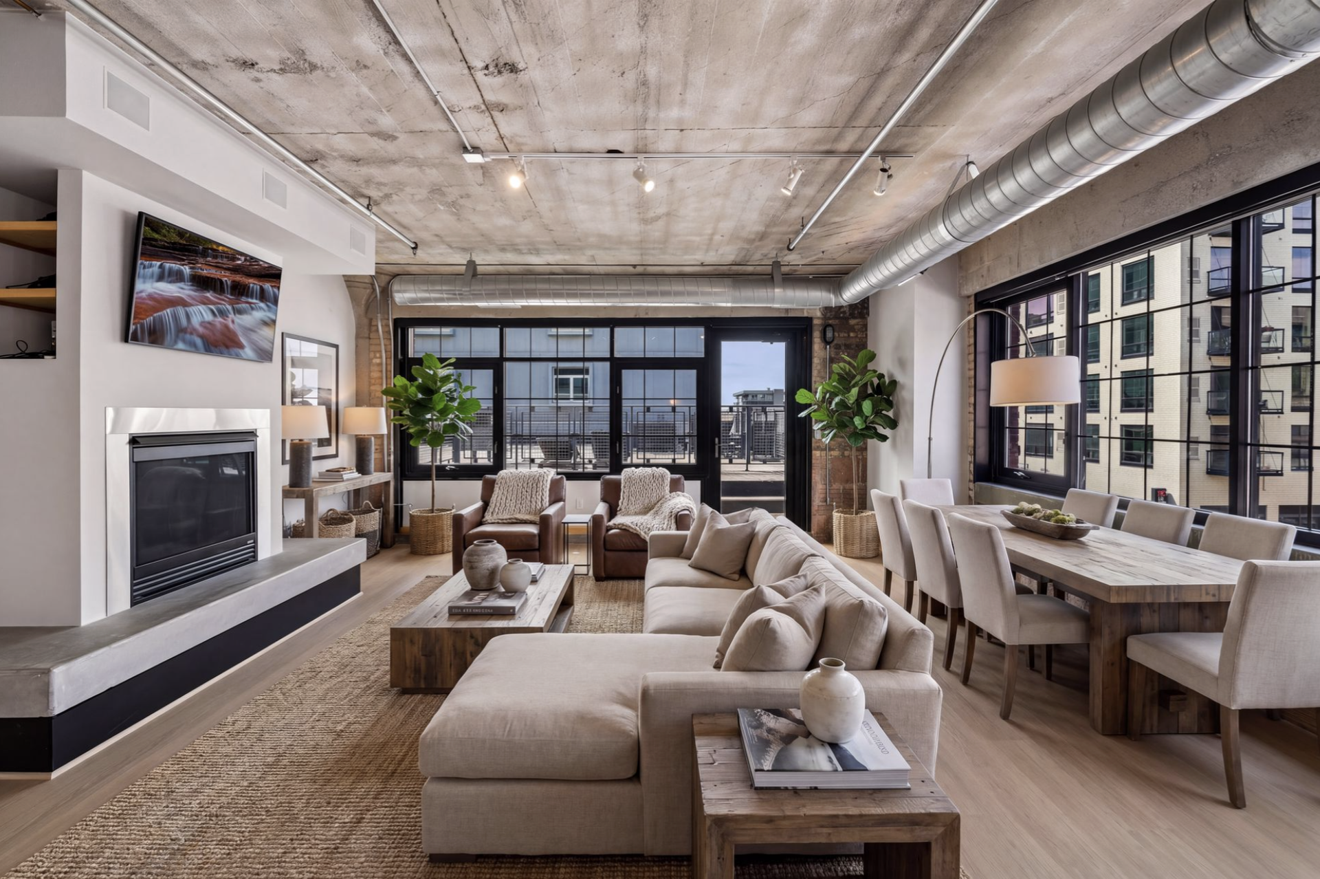 525 3rd Street N, #314, 59, Minneapolis, MN 55401 Virtual staging of large Living and Dining room showing the expansive space and options for placement of furniture