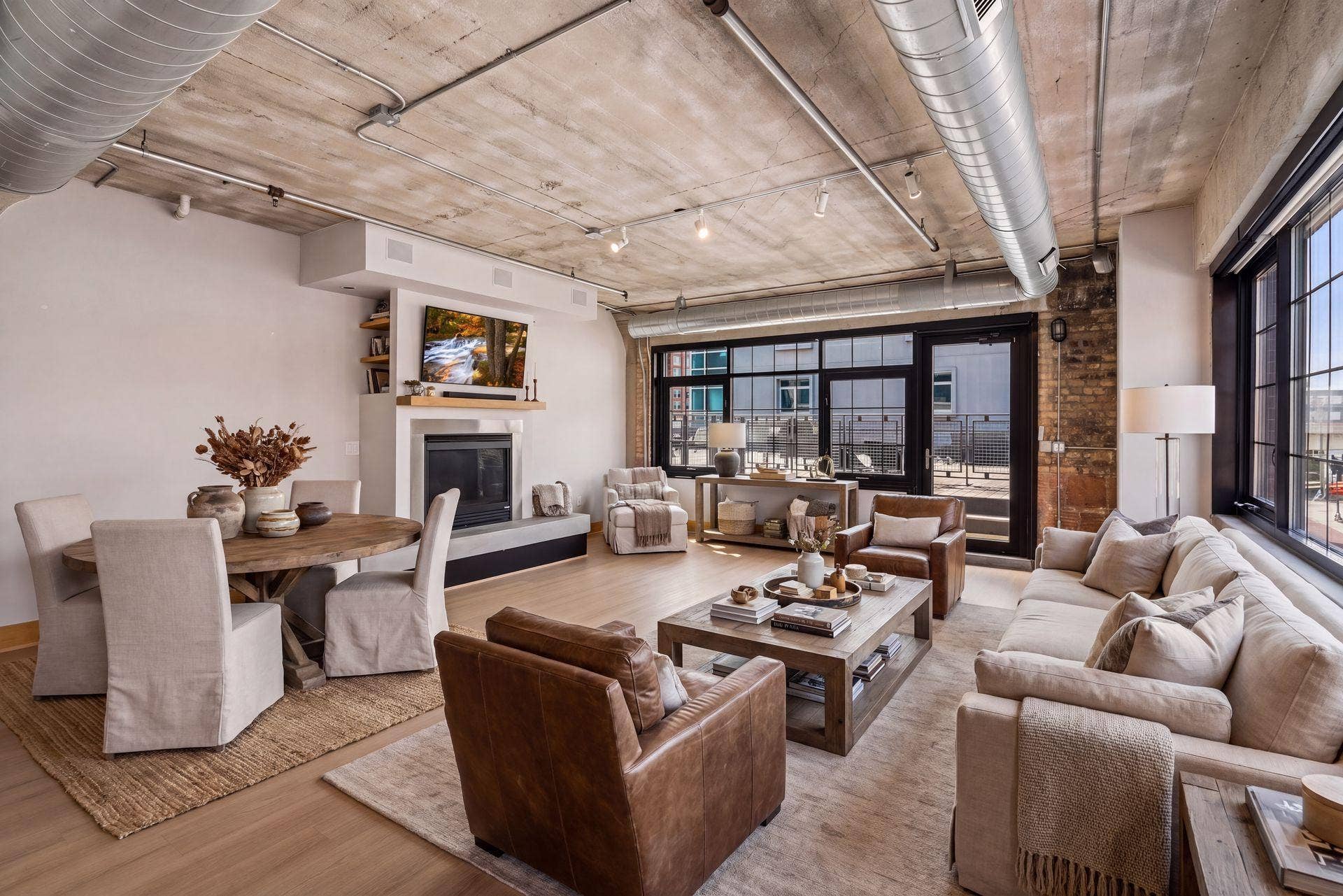 525 3rd Street N, #314, 59, Minneapolis, MN 55401 Virtual staging of large Living and Dining room showing the expansive space and options for placement of furniture