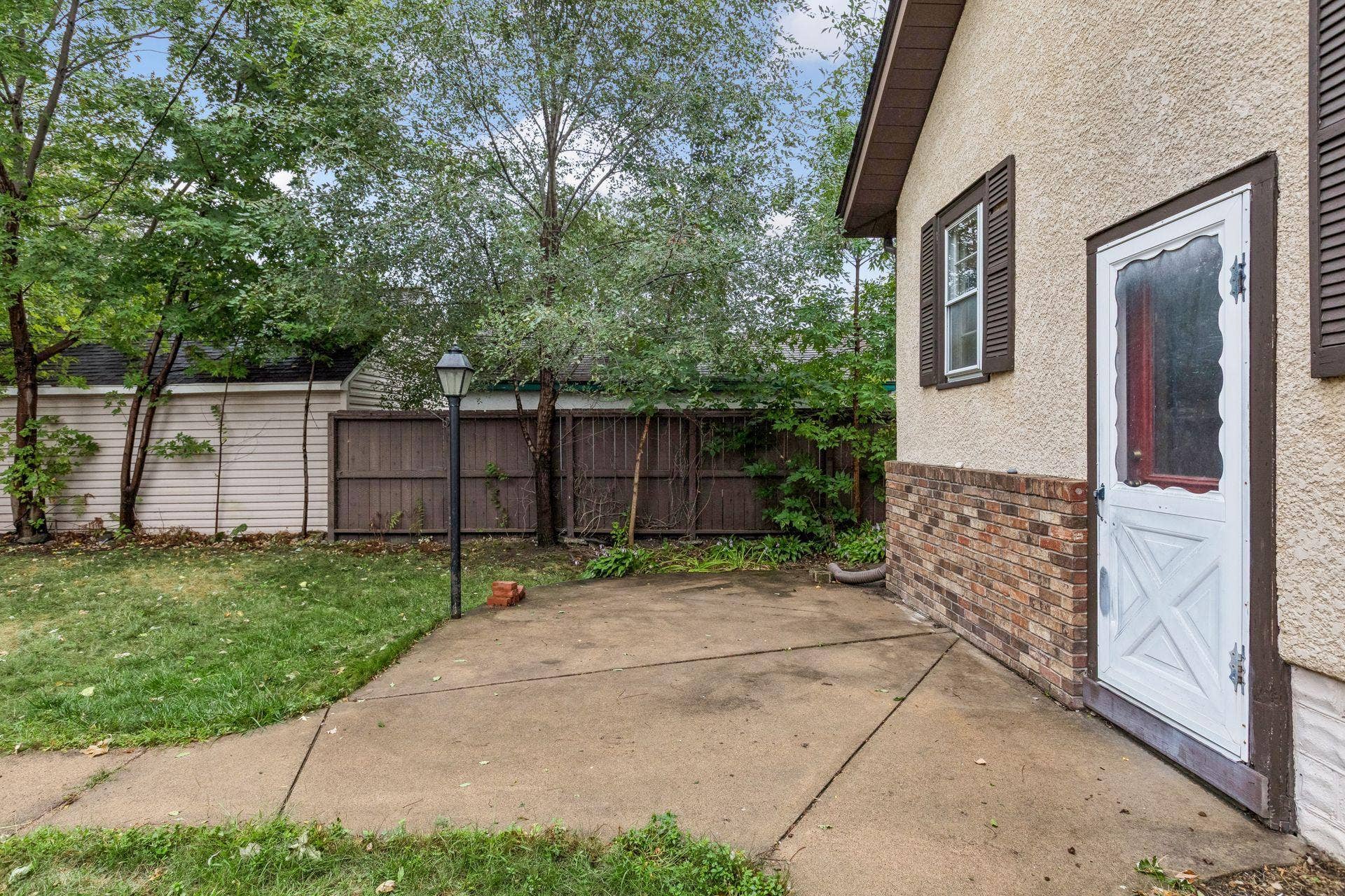 4412 Newton Avenue N, 81, Minneapolis, MN 55412 Concrete patio in back yard