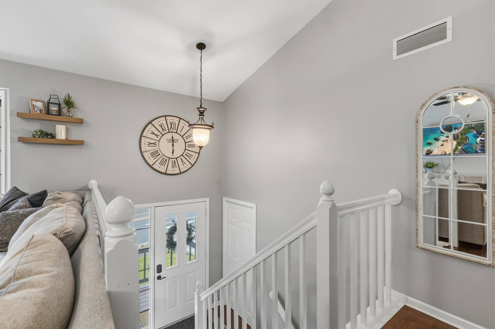 15469 Fish Point Road SE, Prior Lake, MN 55372 Foyer features open staircase that offers enameled railings and maple hardwood treads. Vaulted ceilings