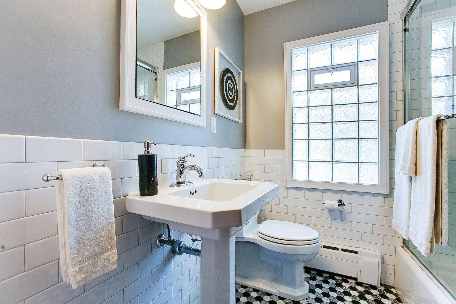 Main floor full primary bath with marble