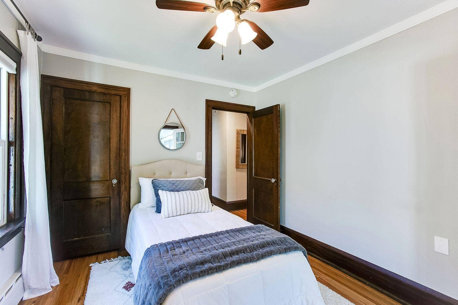 Main floor bedroom 2 with large closet  virtually staged