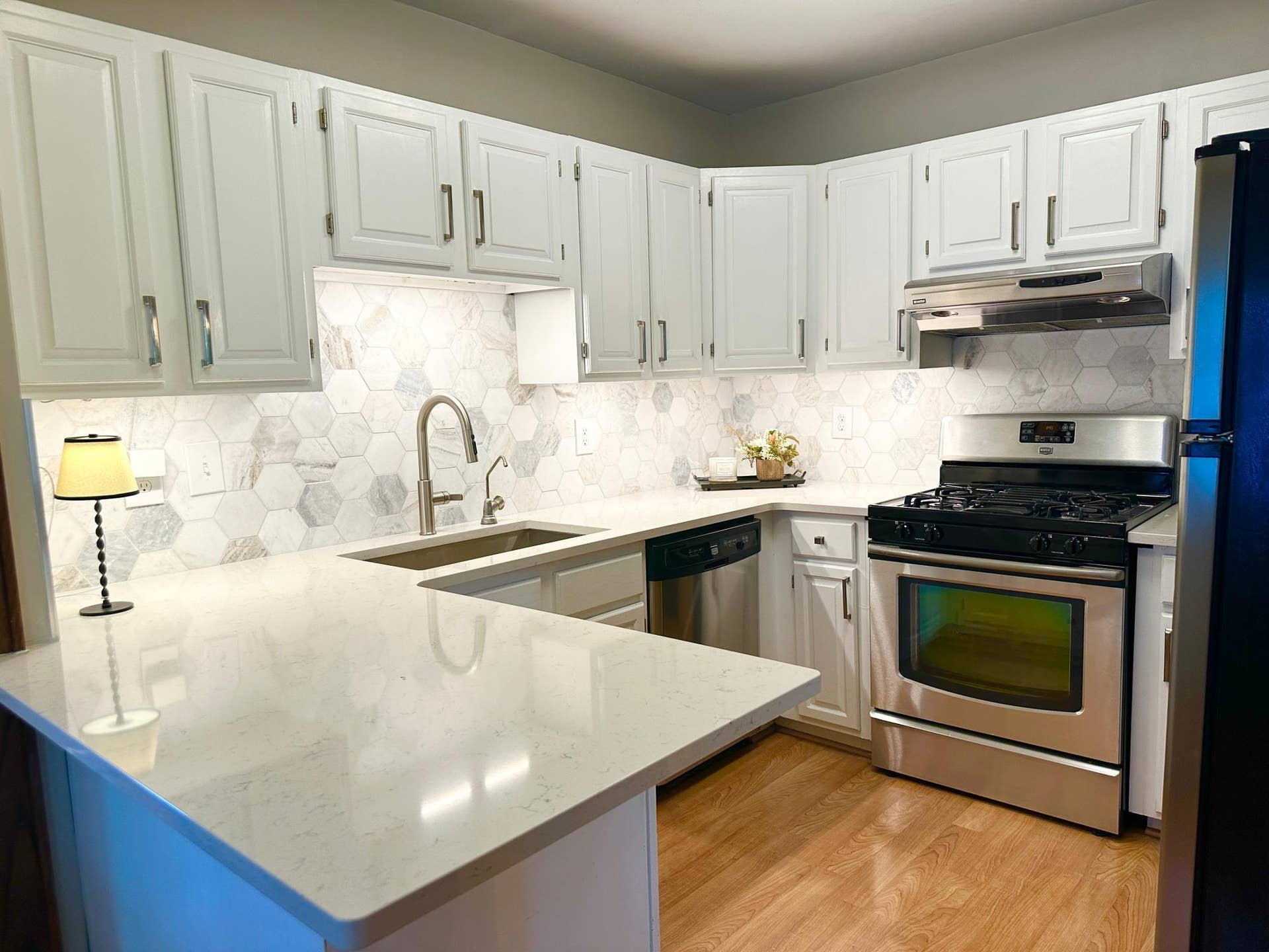 Beautiful quartz countertops and marble backsplash
