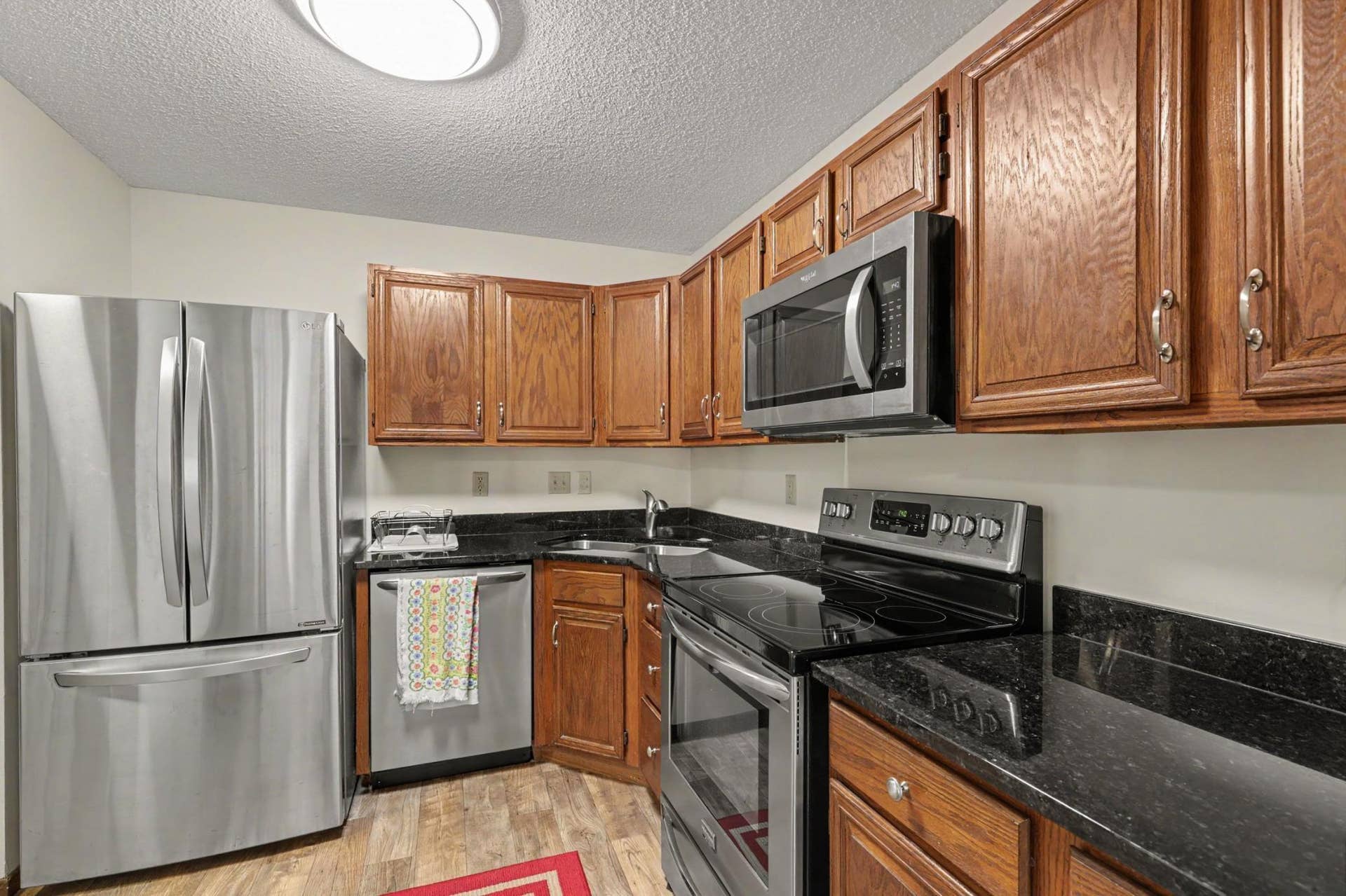 Updated kitchen with new stainless steel applainaces and granite countertops.