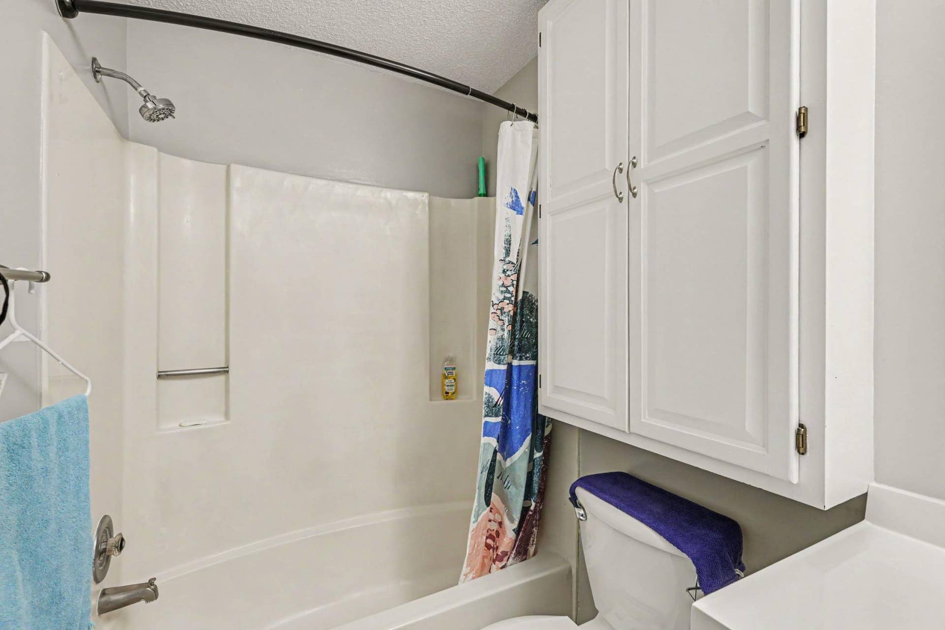 Large bathroom with added storage.