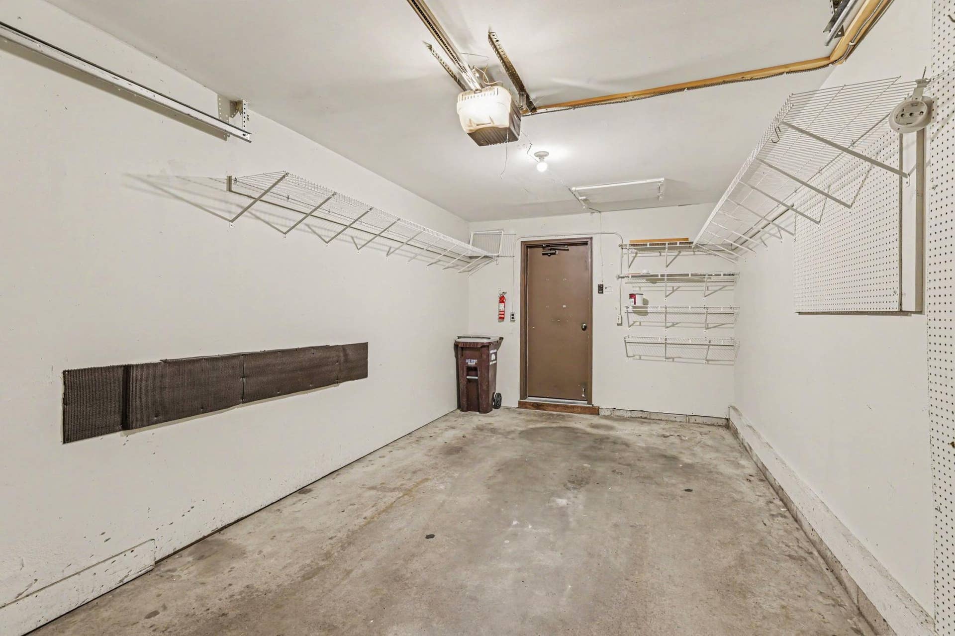 Attached one-car garage with door protector added to protect doors and wall. Storage too!