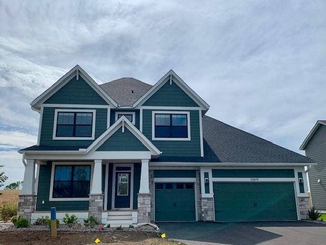 10479 Blackmoor Road, Woodbury, MN 55129 This home features beautiful finishes complete with black contrasting windows and four-sided architectural using LP Smart Side.