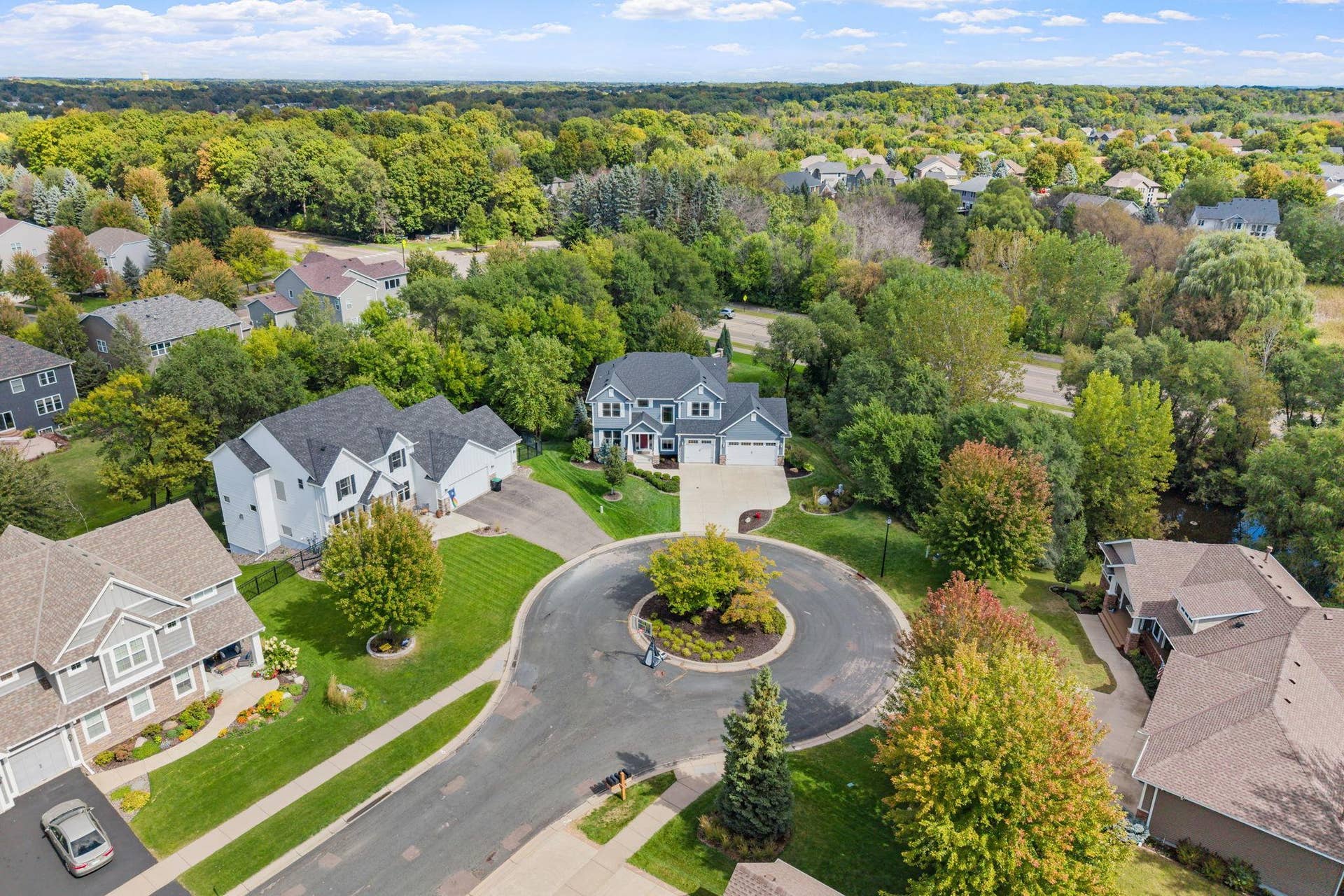 17550 73rd Avenue N, Maple Grove, MN 55311 A beautifully landscaped center island adds charm and character to this quiet cul-de-sac setting.