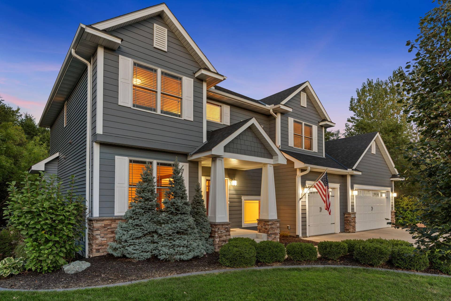 17550 73rd Avenue N, Maple Grove, MN 55311 Upgraded landscaping and lush greenery surround the home, creating a beautiful setting from the front yard to the backyard.