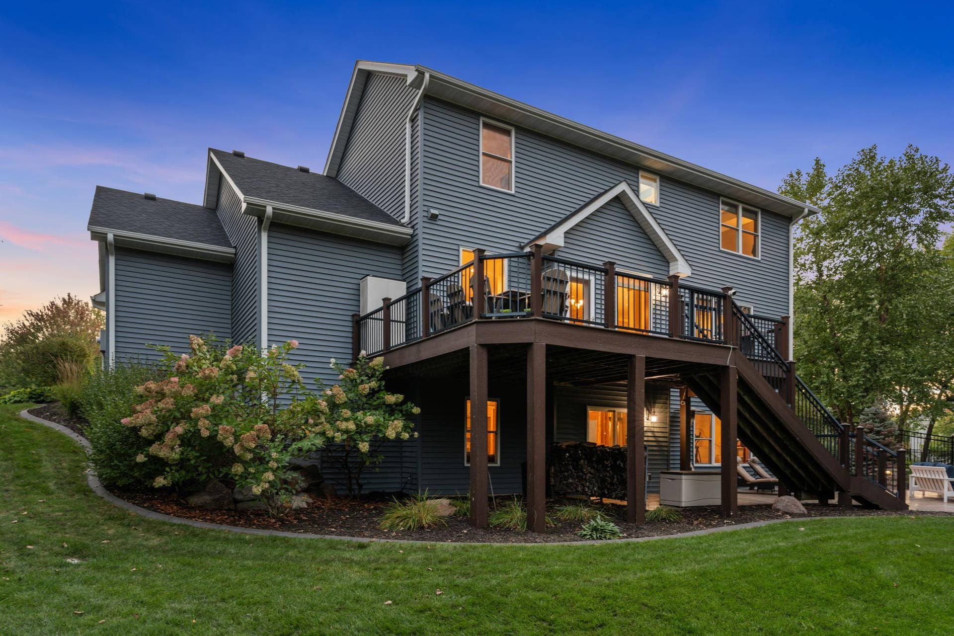 17550 73rd Avenue N, Maple Grove, MN 55311 The thoughtfully designed landscaping adds color, character, and dimension throughout the property.