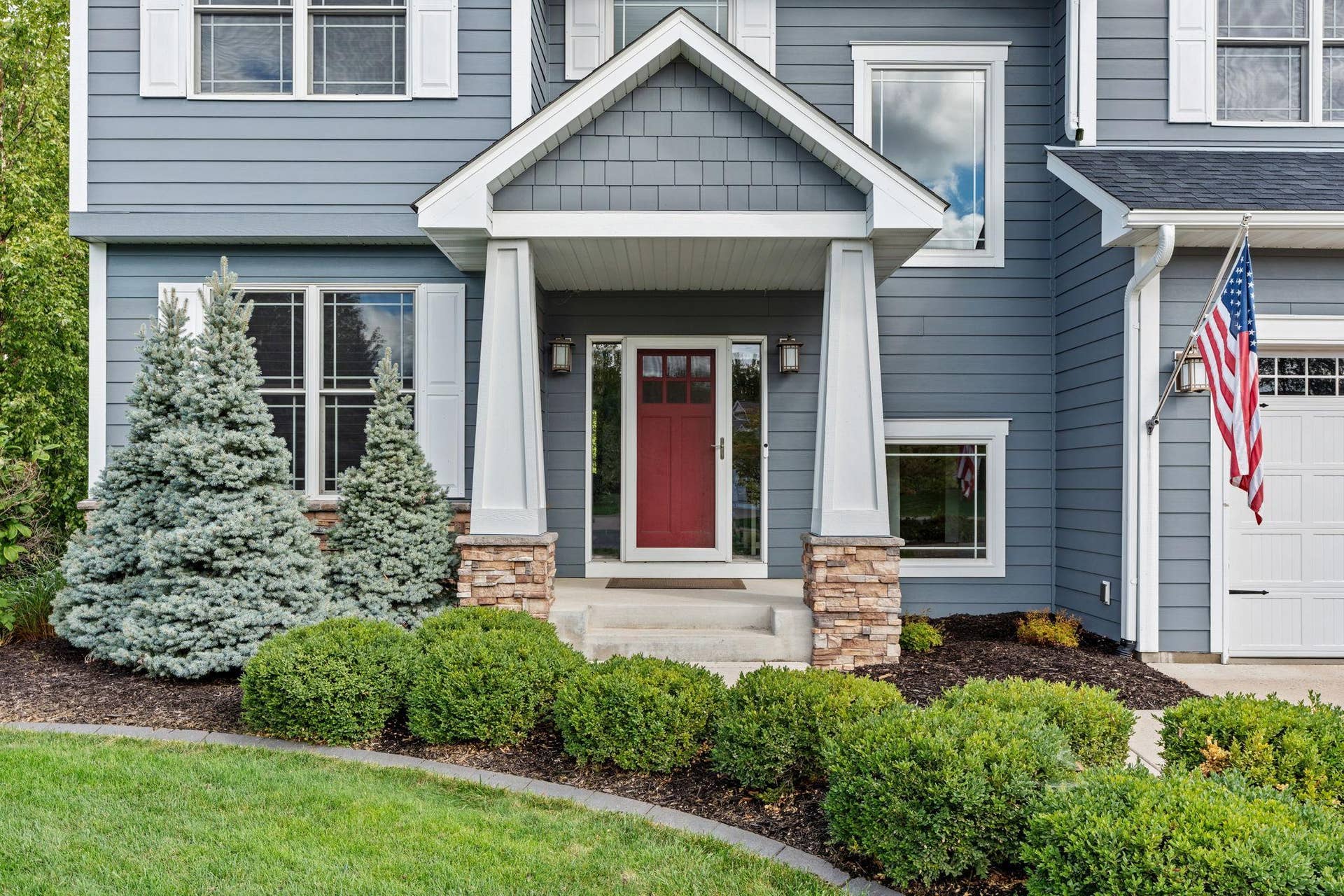 17550 73rd Avenue N, Maple Grove, MN 55311 Quality craftsmanship is evident from the moment you arrive, with a welcoming front porch and beautifully finished exterior details.