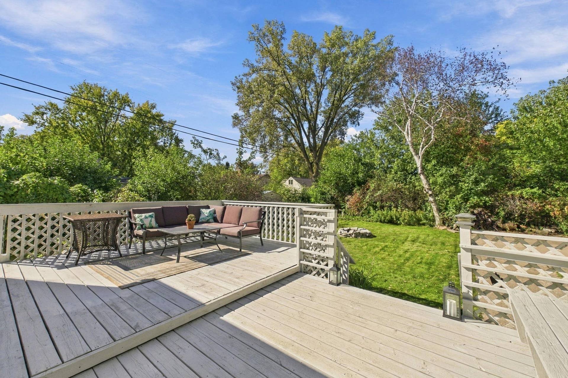 2359 Victoria Street N, Roseville, MN 55113 Spacious Backyard Deck Surrounded by Lush Greenery