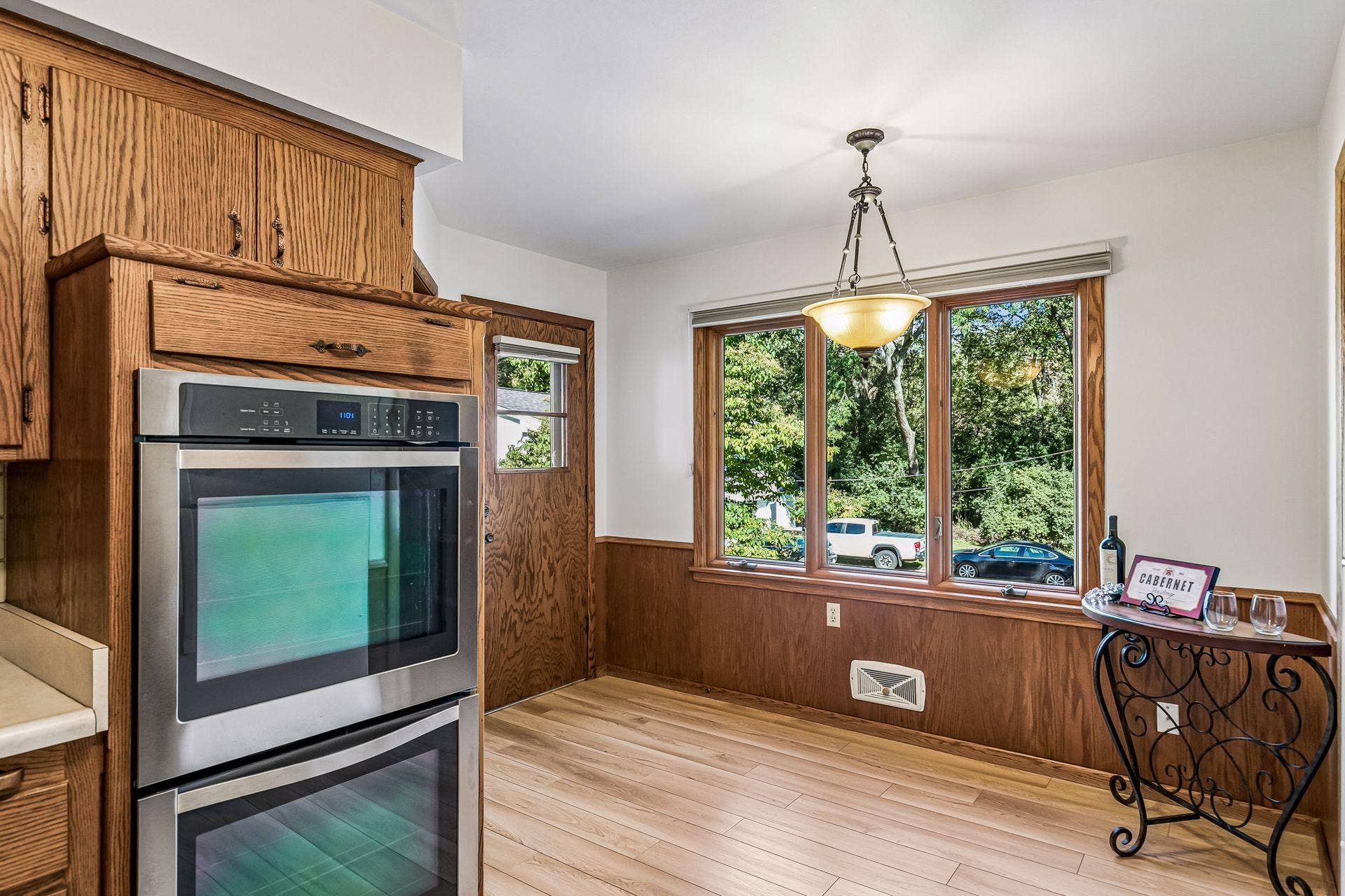 2931 Cedar Knoll Court, Minnetonka, MN 55305 A large picture window and door leads to a small deck.