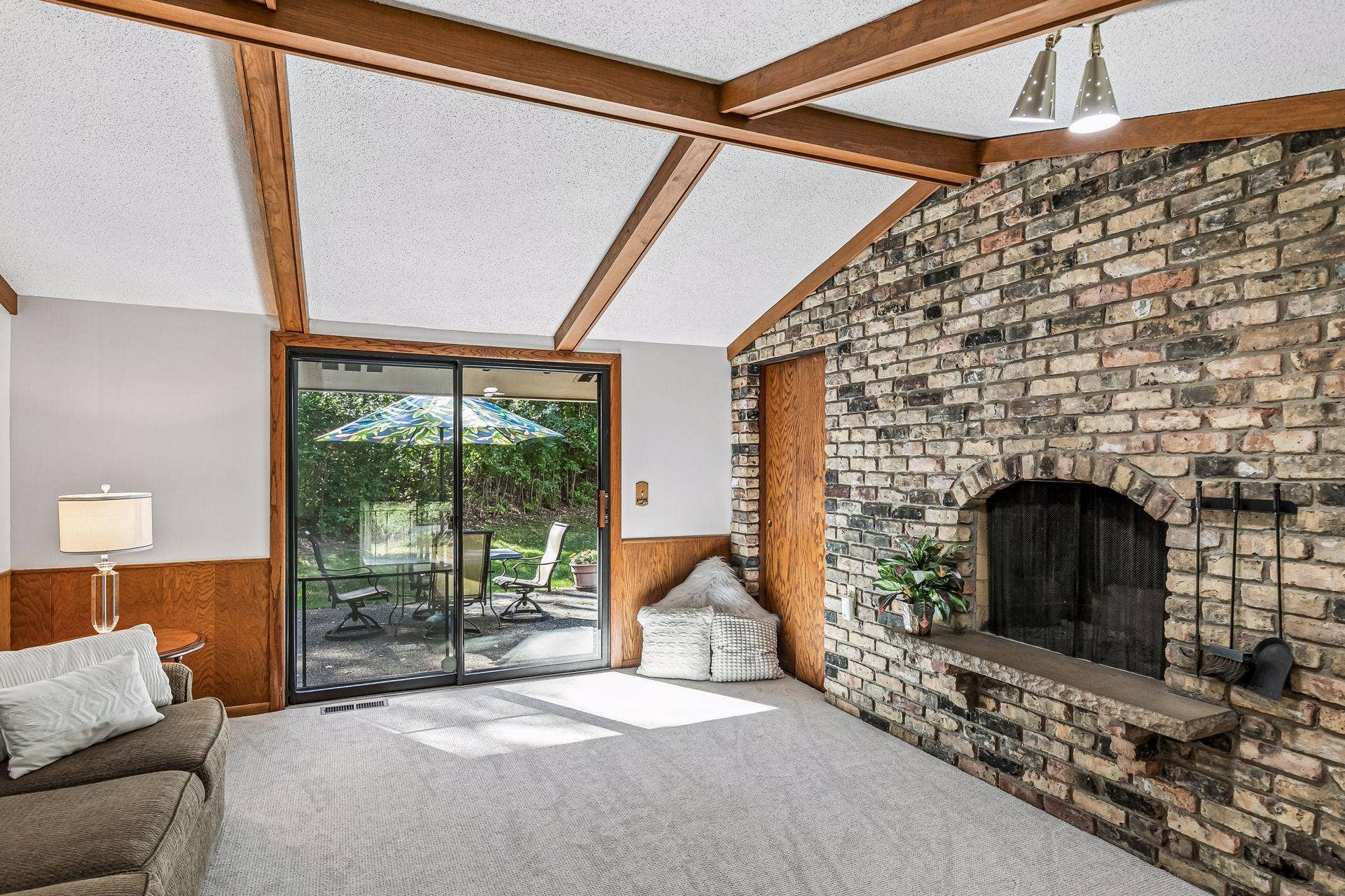 2931 Cedar Knoll Court, Minnetonka, MN 55305 Family Room with beautiful brick fireplace and sliding doors to patio.