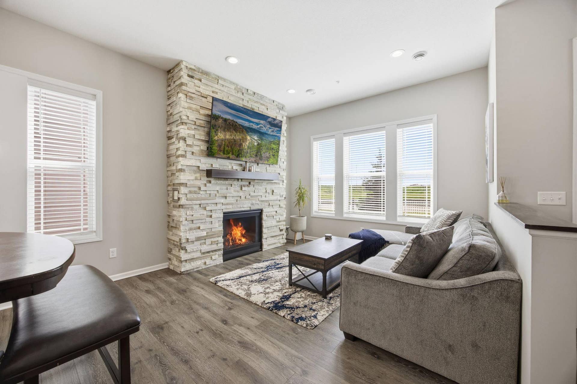 8164 Arrowwood Lane N, Maple Grove, MN 55369 Bright living room with a gas fireplace, creating a warm and inviting main-level focal point