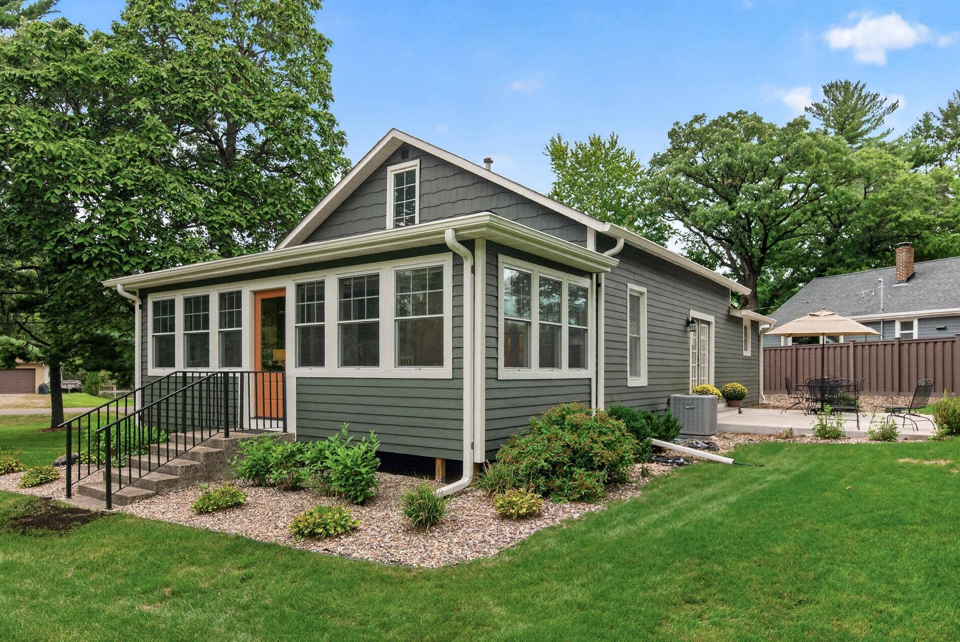 1835 Stillwater Street, White Bear Lake, MN 55110 Freshly painted siding, new exterior doors, refined exterior lighting, & custom railings complement the home's classic architectural character.