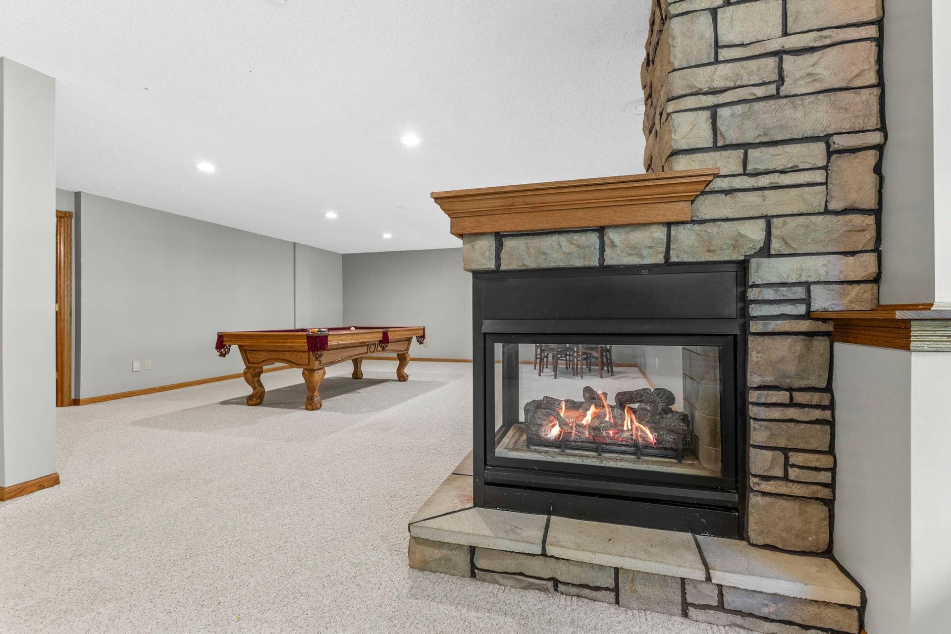 19497 Boston Street NW, Elk River, MN 55330 The basement recreation room features the home's second fireplace.