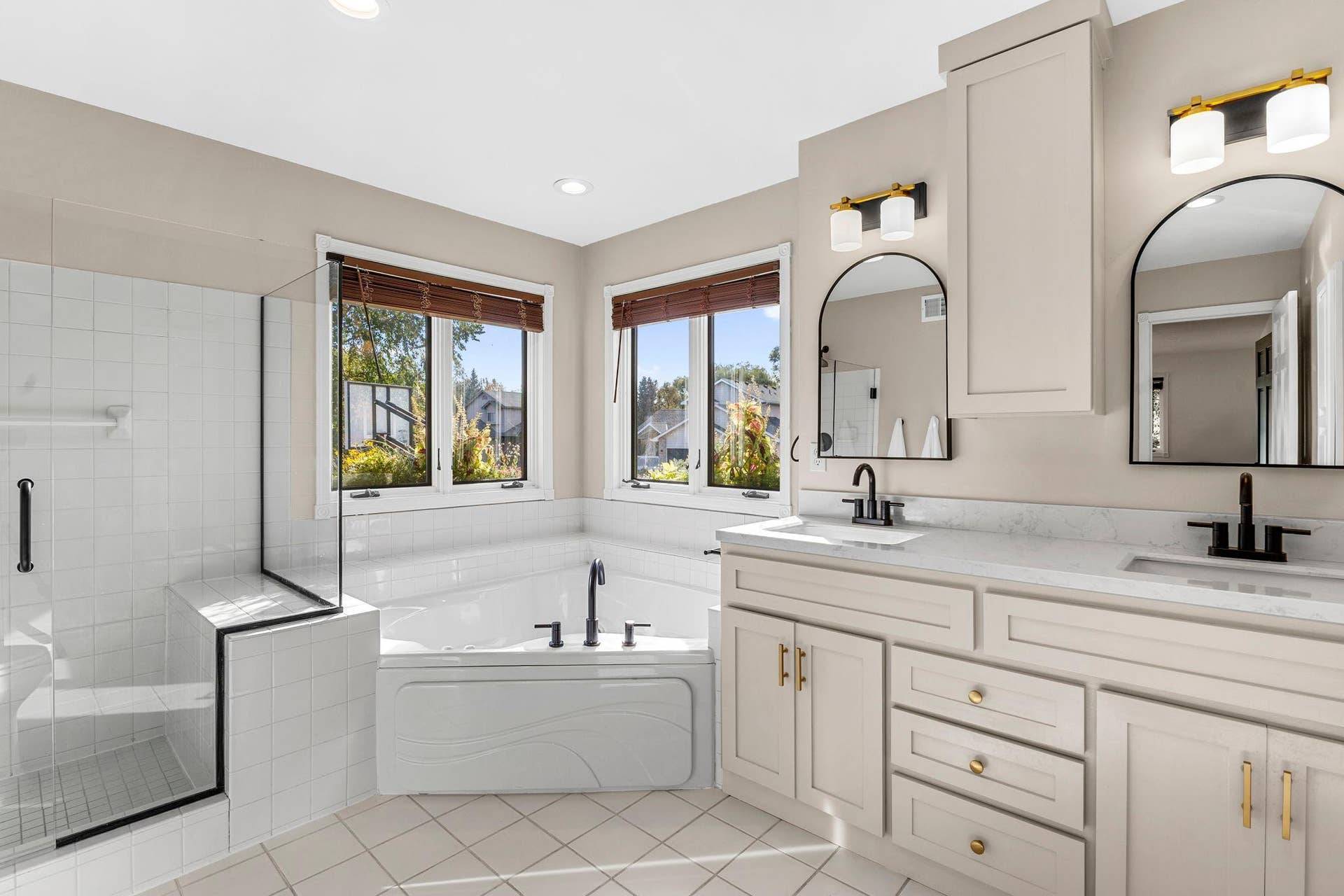19497 Boston Street NW, Elk River, MN 55330 The primary bathroom features an updated tile shower and separate bathtub.