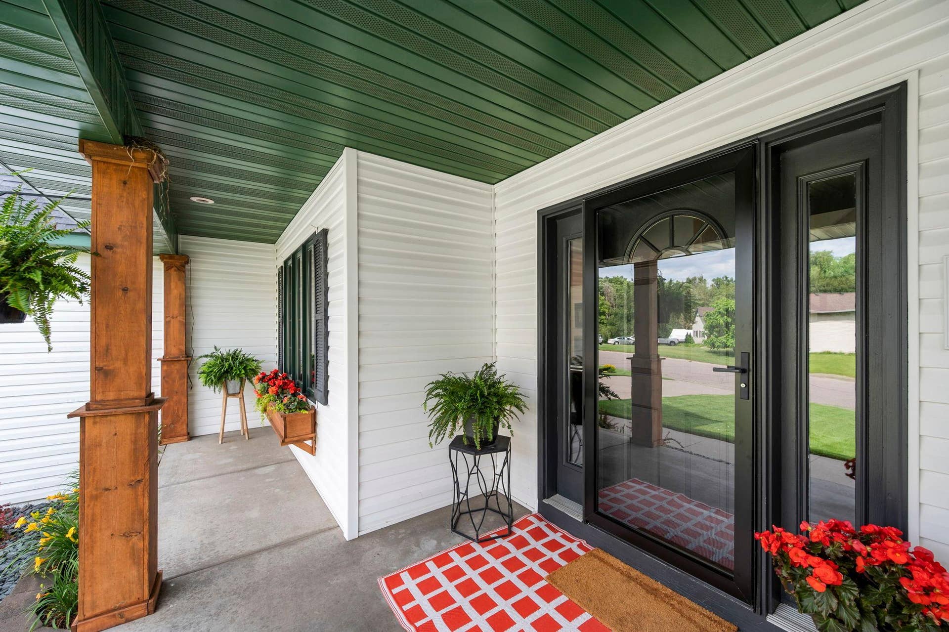 19497 Boston Street NW, Elk River, MN 55330 The front porch is welcoming and sheltered from the elements.