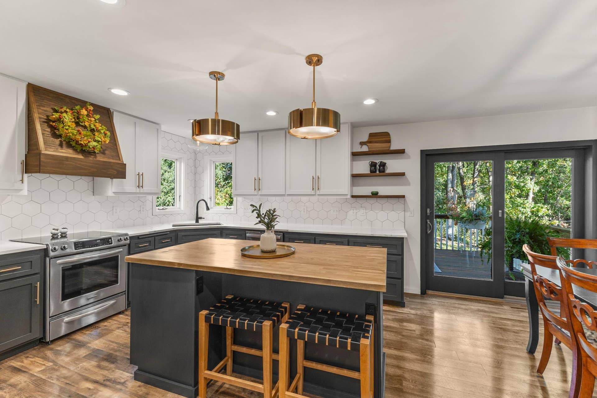 19497 Boston Street NW, Elk River, MN 55330 The kitchen has been updated with a modern backsplash and gold fixtures.