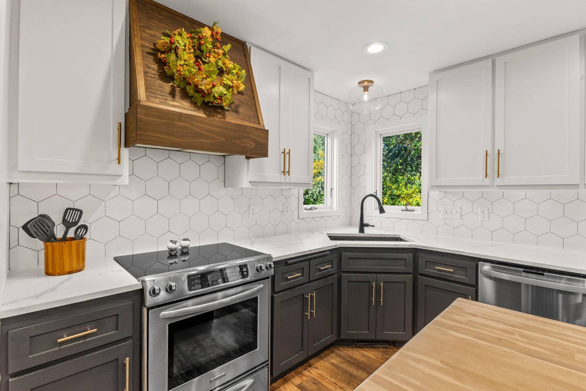 19497 Boston Street NW, Elk River, MN 55330 The hood over the stove accentuates the butcher block center island.