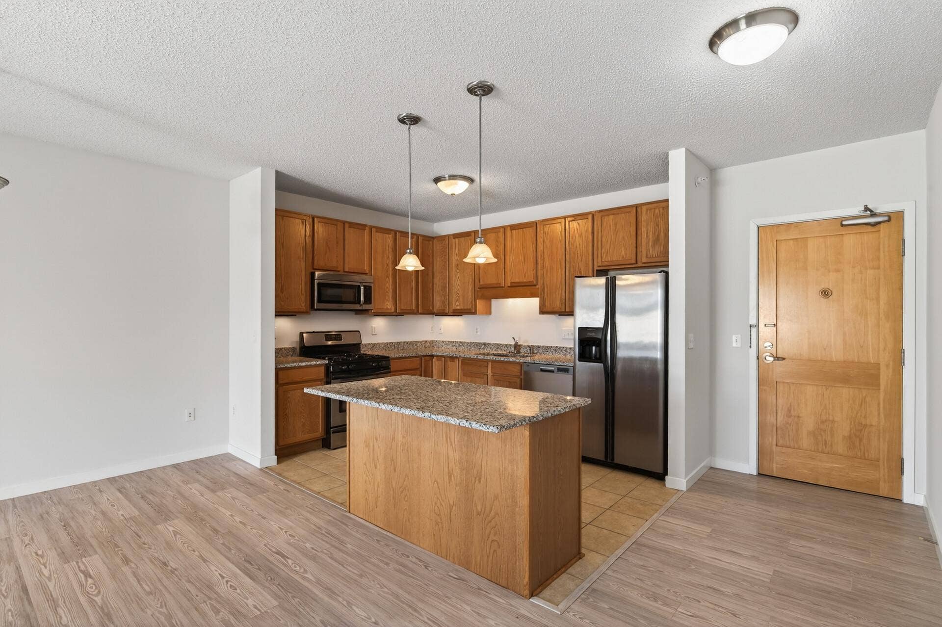 619 8th Street SE, #308, 50, Minneapolis, MN 55414 Updated kitchen featuring granite countertops and stainless-steel appliances.