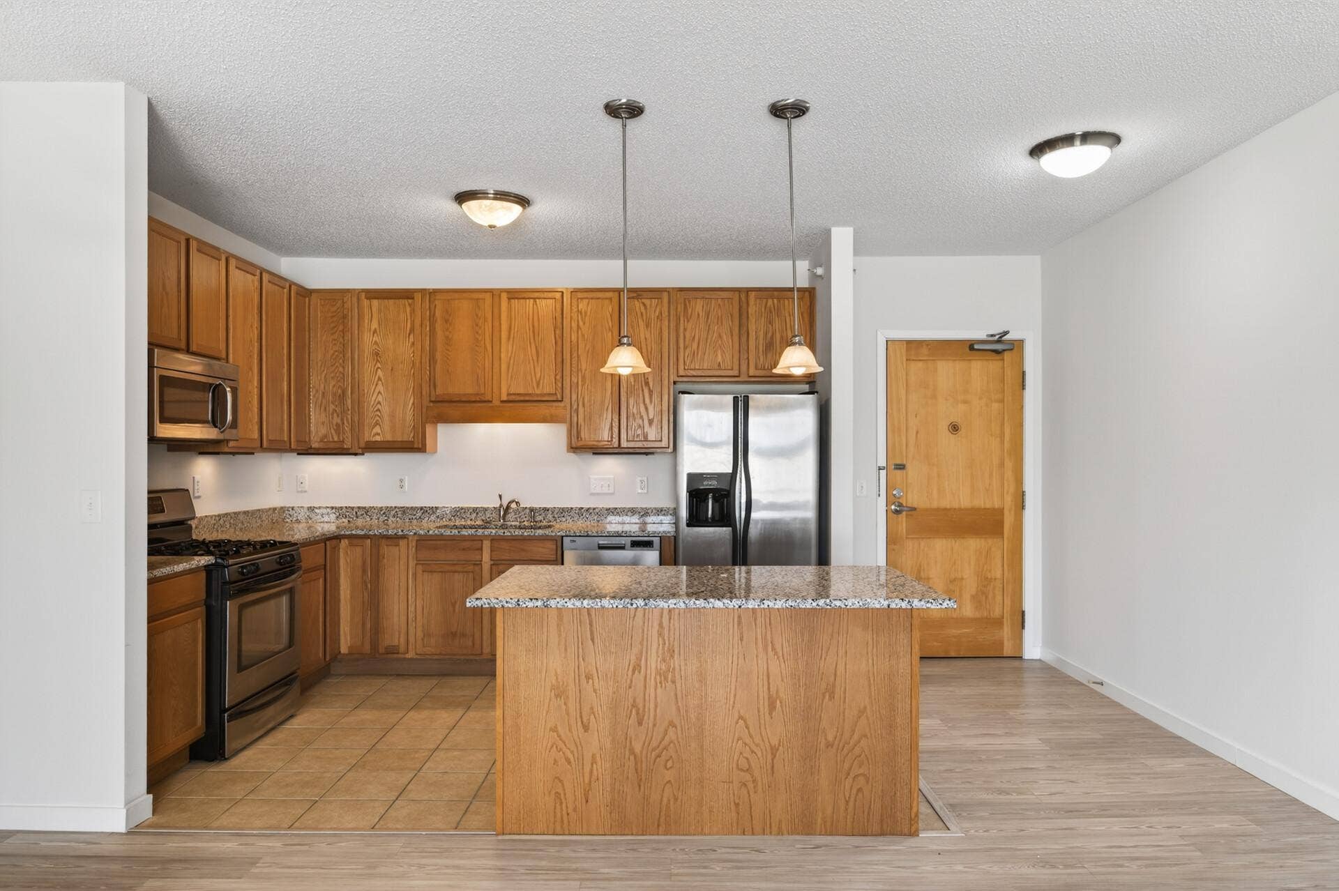 619 8th Street SE, #308, 50, Minneapolis, MN 55414 Center island provides additional prep space and casual seating.