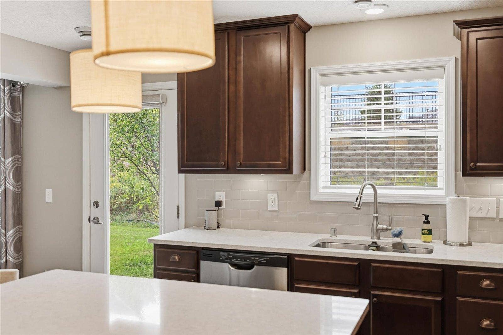 9757 5th Street Lane N, Lake Elmo, MN 55042 Full glass door to the patio to bring in even more light