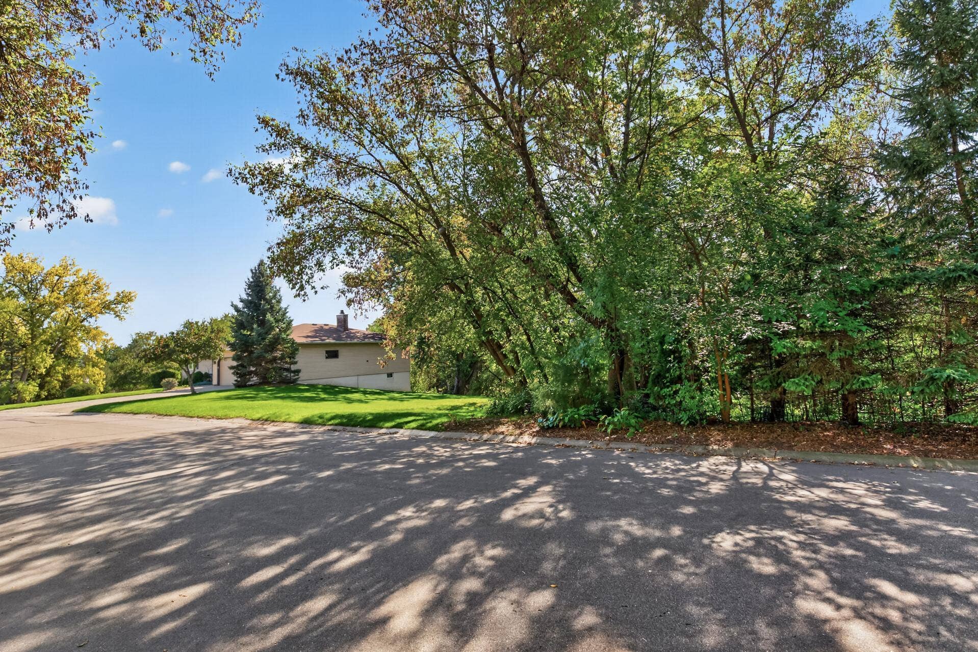 4315 Kaufmanis Way, Eagan, MN 55123 Front view shows the wooded part of the lot providing abundant privacy