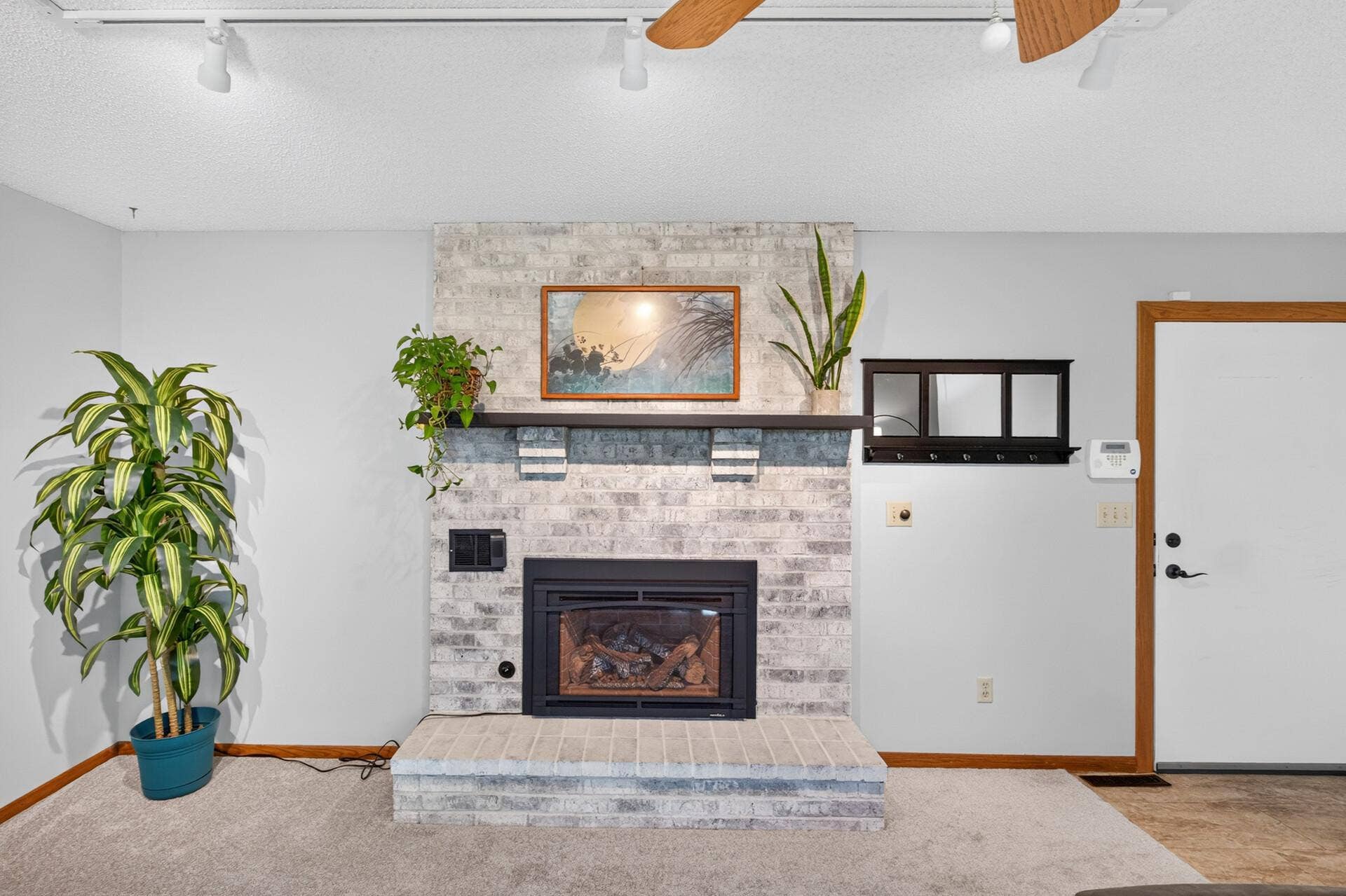 4315 Kaufmanis Way, Eagan, MN 55123 Gas fireplace for ease of use with beautiful brick surround