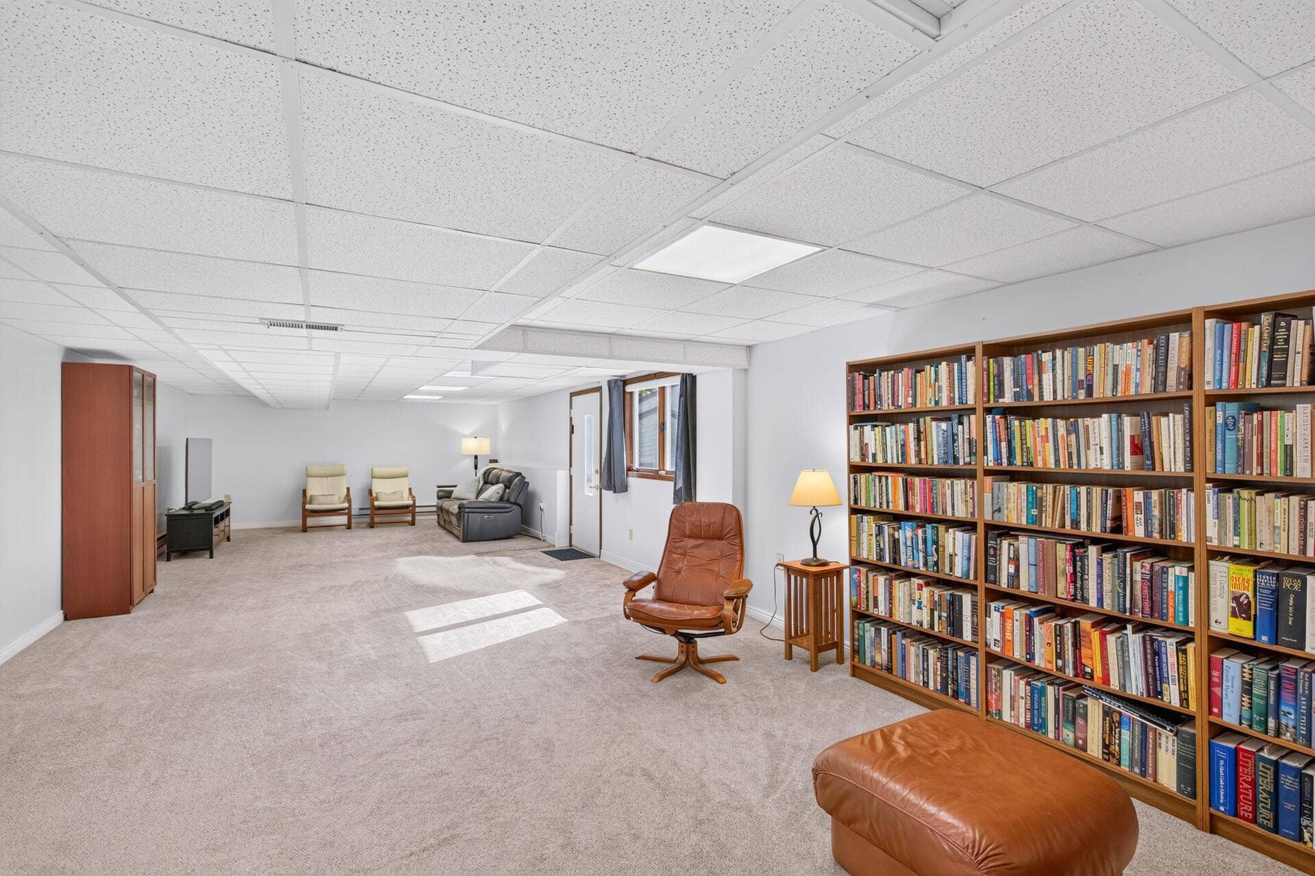 4315 Kaufmanis Way, Eagan, MN 55123 Expansive lower-level recreation room offers exceptional flexibility for entertaining, relaxing, hobbies or a home library