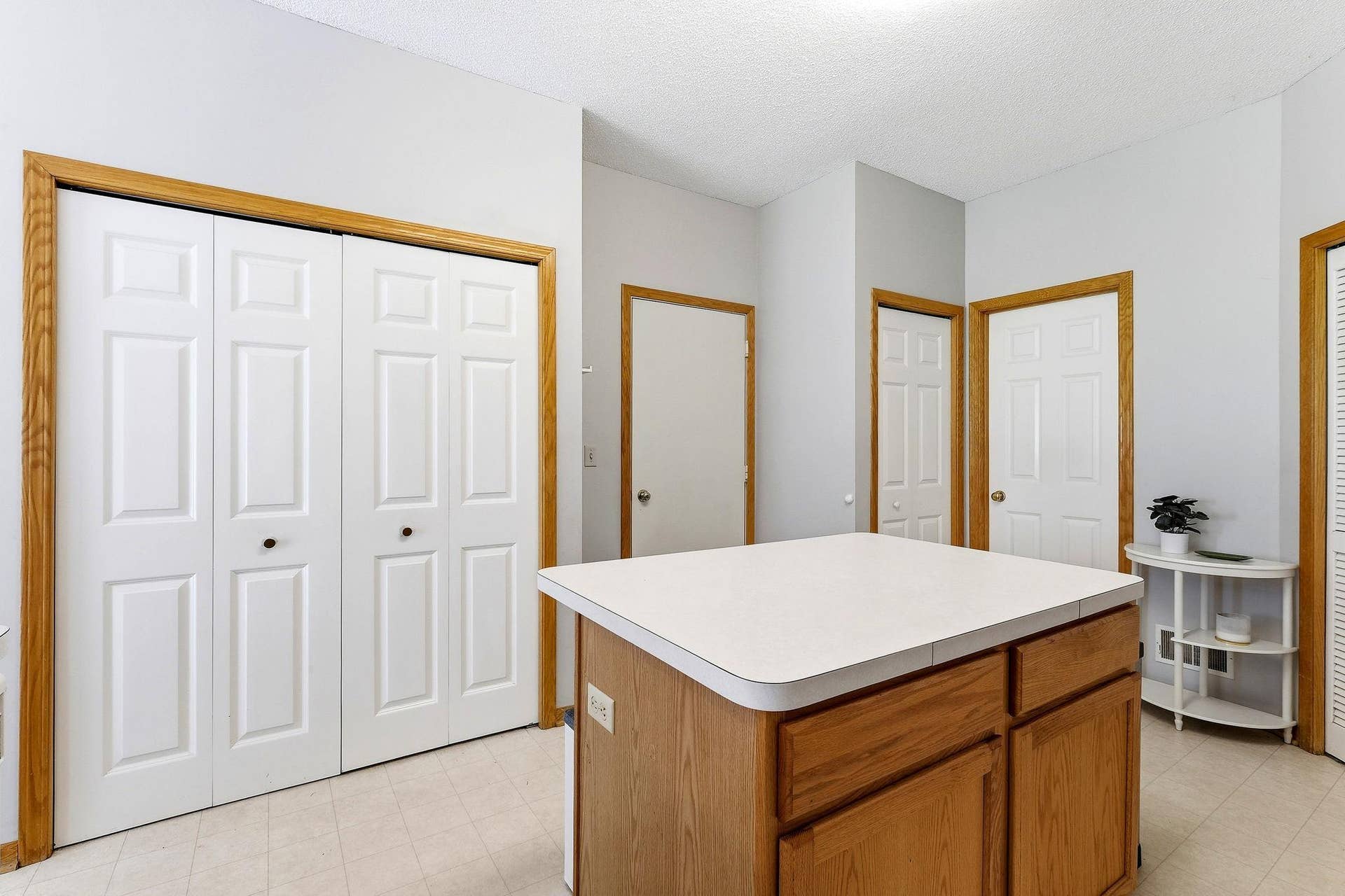 1899 Wildflower Court, Shoreview, MN 55126 Double doors are for the pantry. Middle door is garage, right middle is entry closet and far right is the powder room.