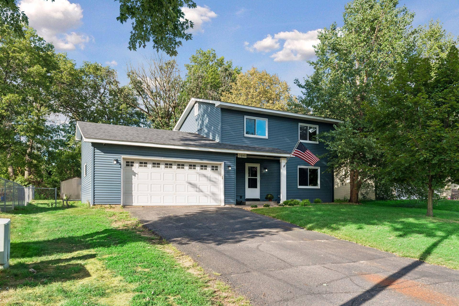 2841 Riviera Drive N, White Bear Lake, MN 55110 Attached two-car garage and paved driveway. Roof and siding replaced in 2022.