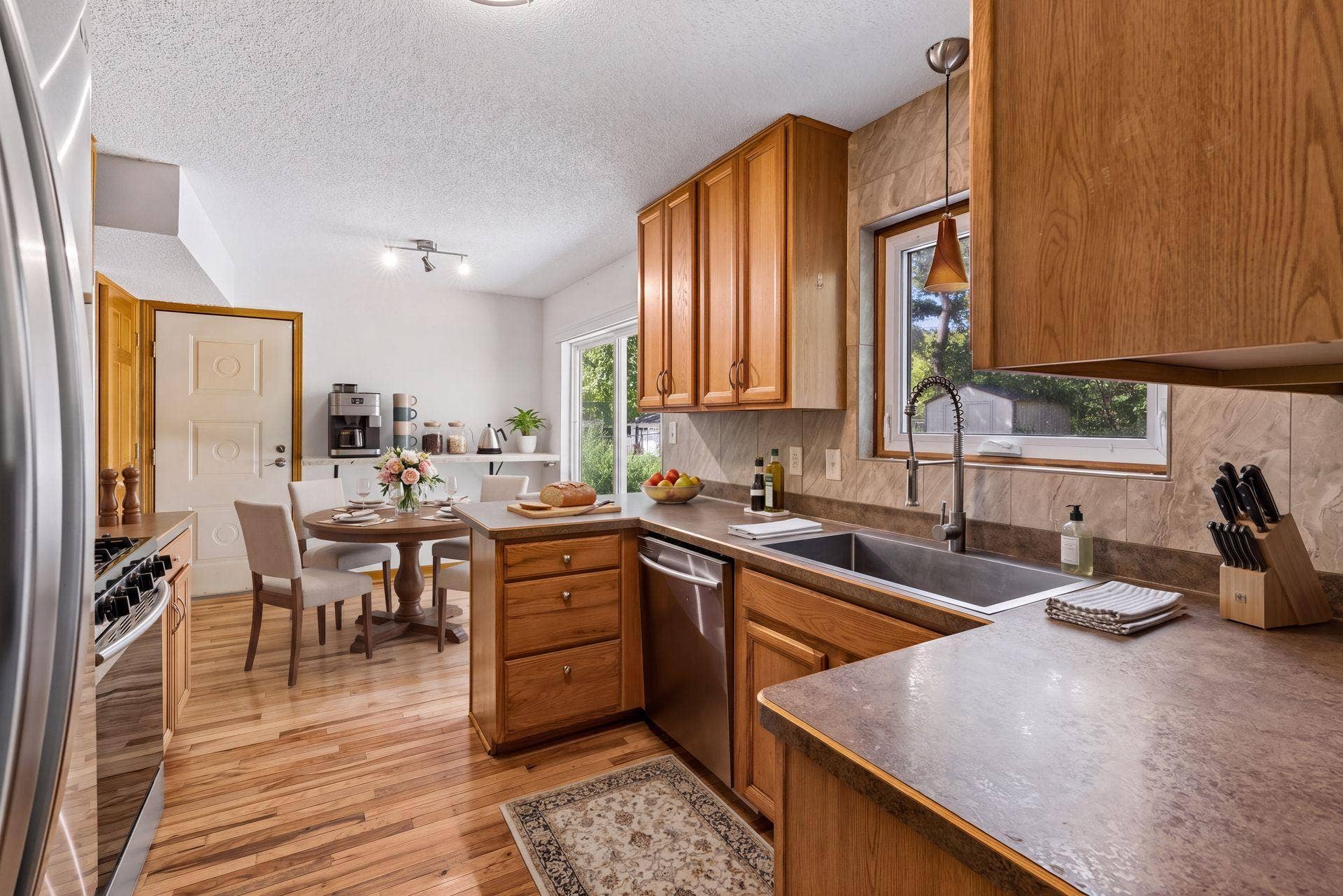 2841 Riviera Drive N, White Bear Lake, MN 55110 Virtually staged kitchen and breakfast area illustrate a possible dining setup