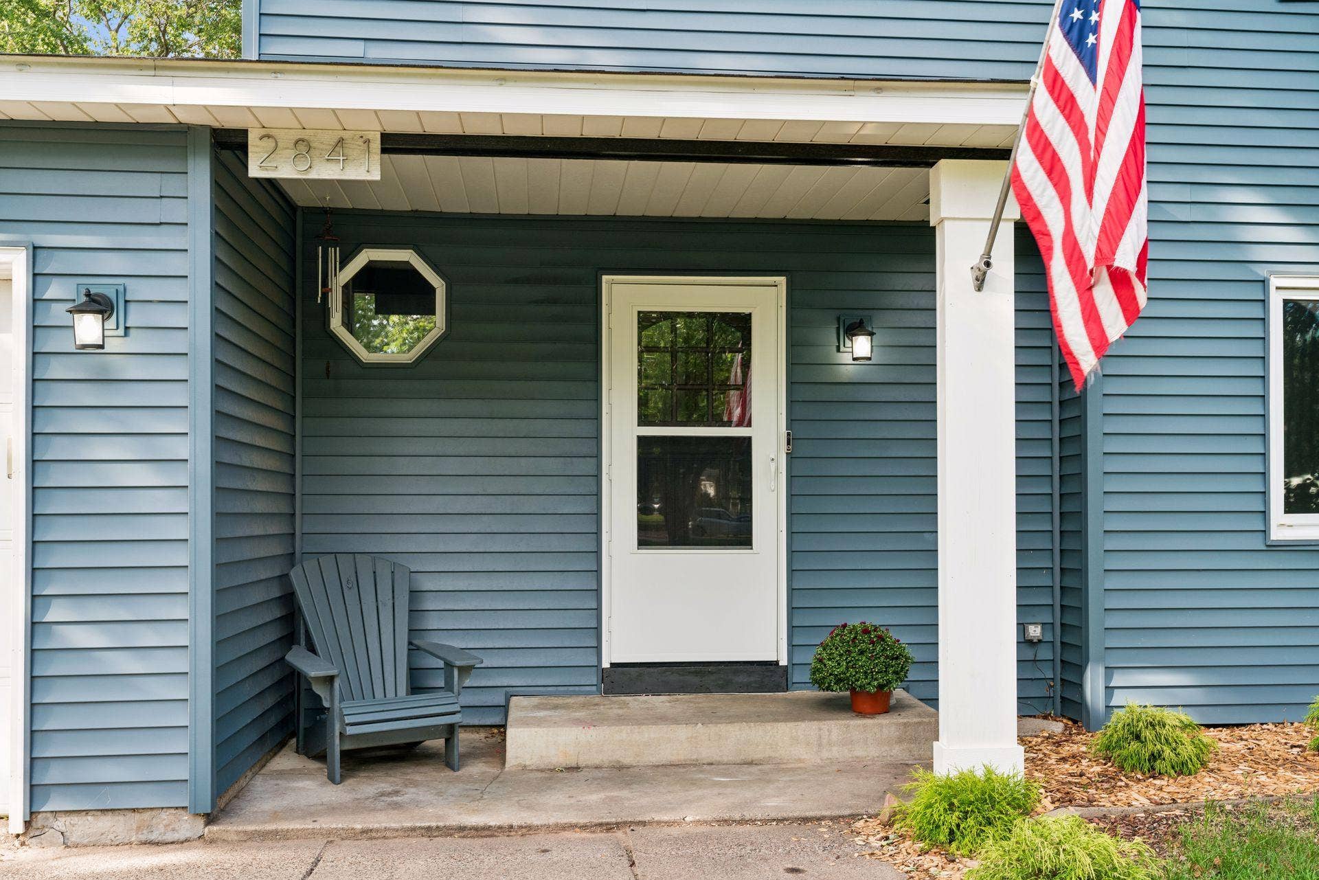 2841 Riviera Drive N, White Bear Lake, MN 55110 Covered front entry with space for a chair and seasonal accents.
