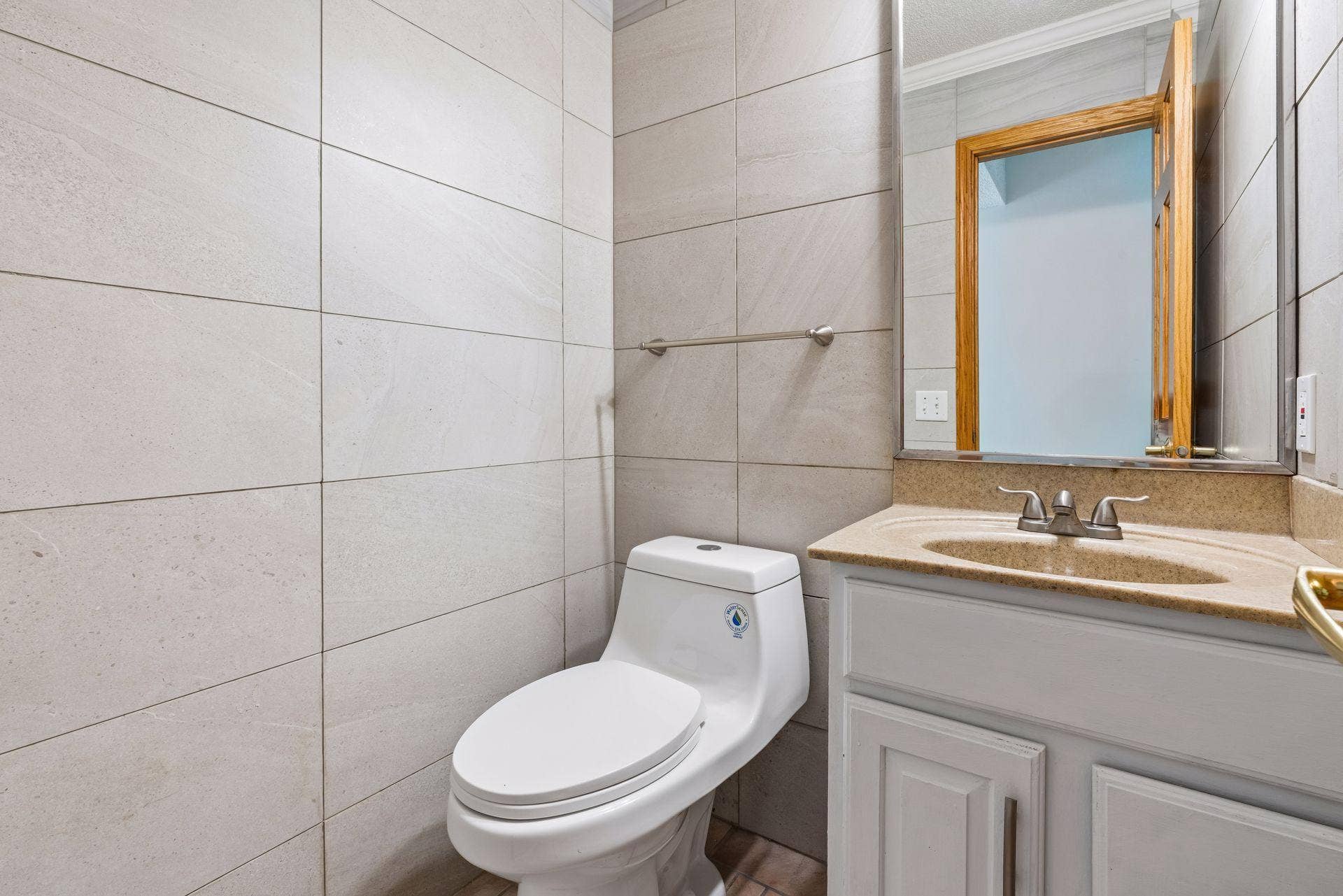 2841 Riviera Drive N, White Bear Lake, MN 55110 alf bath with tile finishes and a vanity with storage.