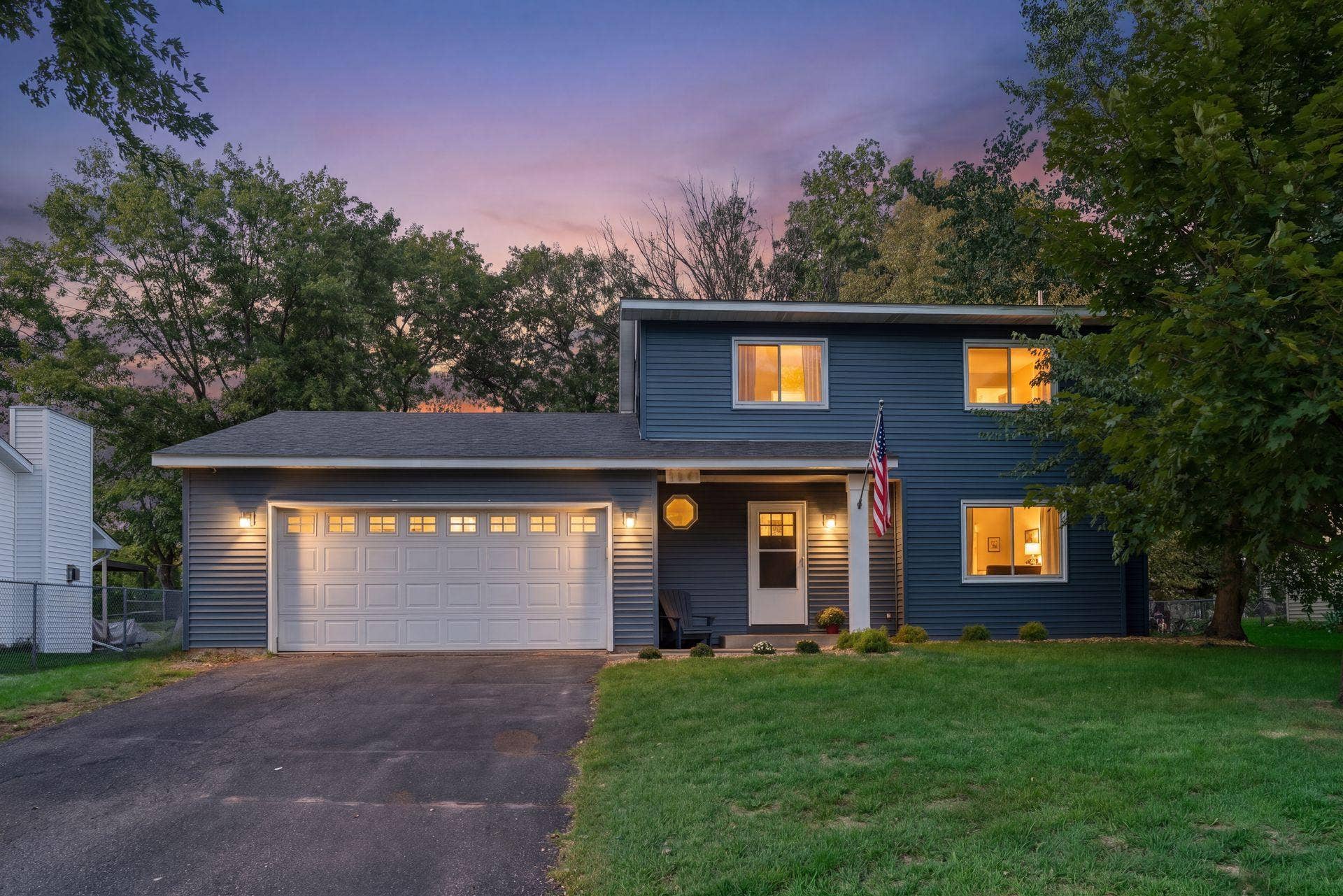 2841 Riviera Drive N, White Bear Lake, MN 55110 Twilight view of the homes inviting exterior and covered front entry.