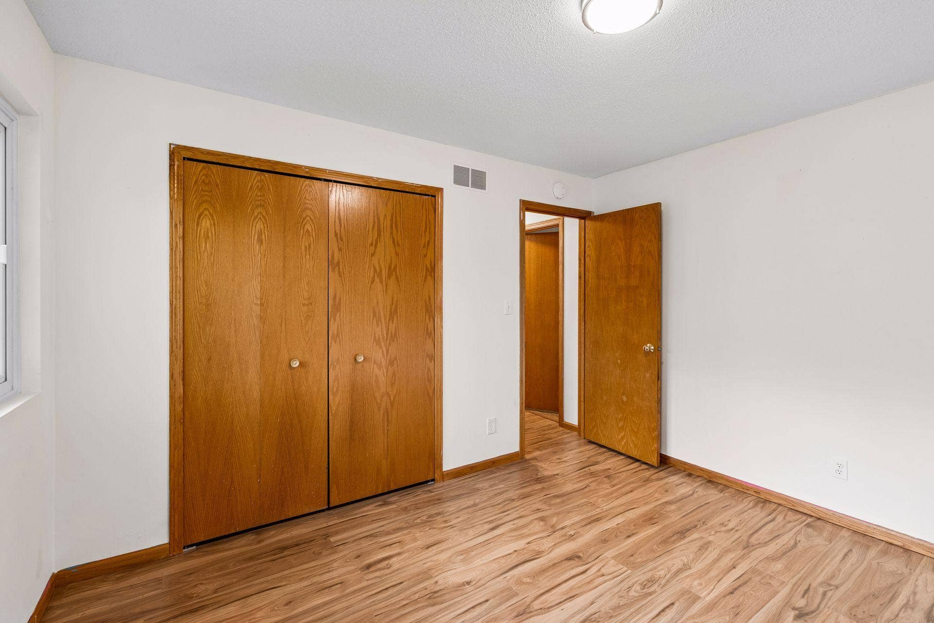 2841 Riviera Drive N, White Bear Lake, MN 55110 Bedroom three includes a wide closet with bifold doors.