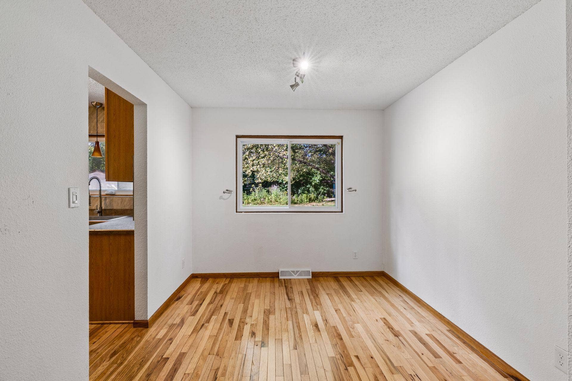 2841 Riviera Drive N, White Bear Lake, MN 55110 Dining area with hardwood flooring and convenient kitchen access.