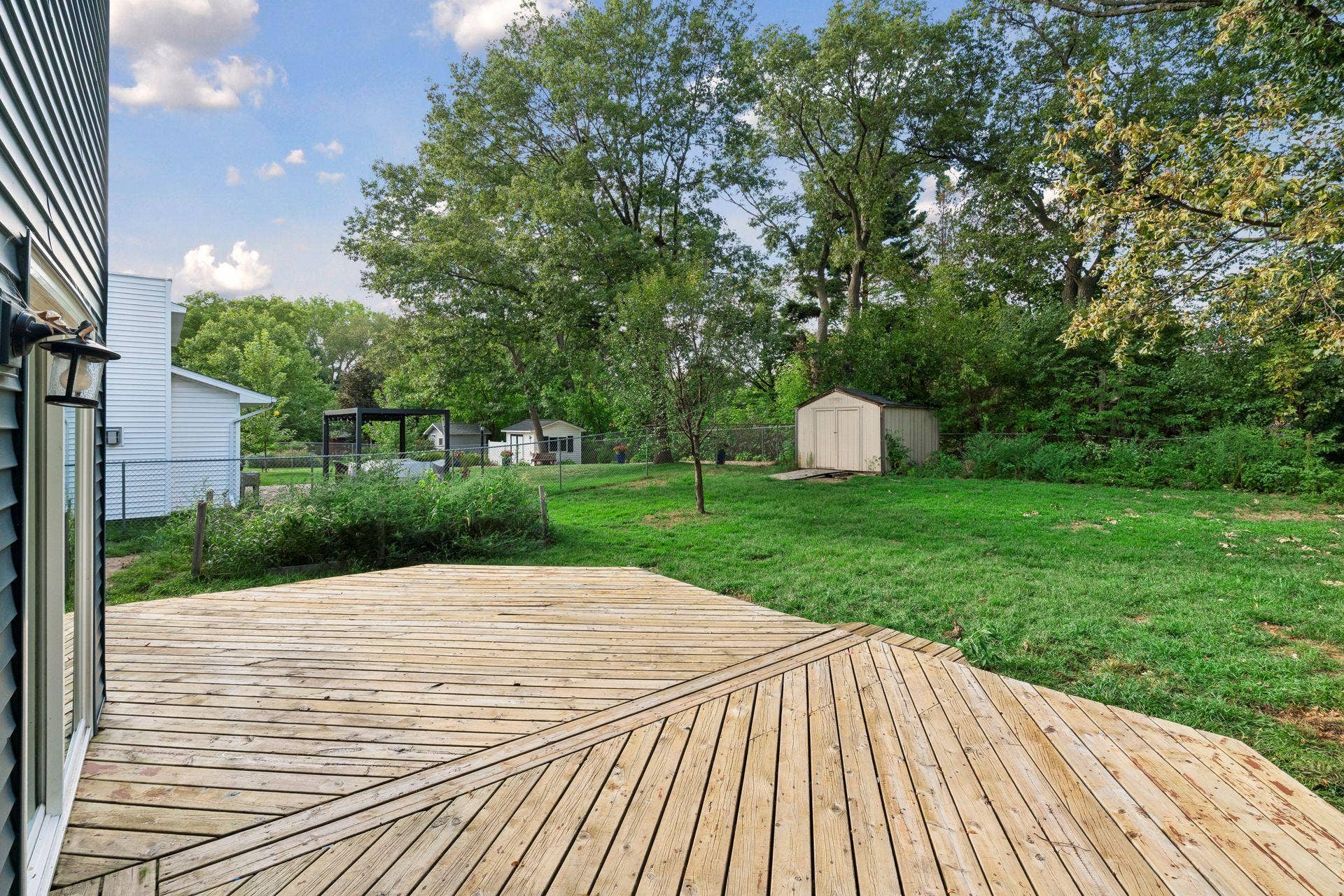 2841 Riviera Drive N, White Bear Lake, MN 55110 Deck and backyard offer space for outdoor dining, relaxing, and gardening.