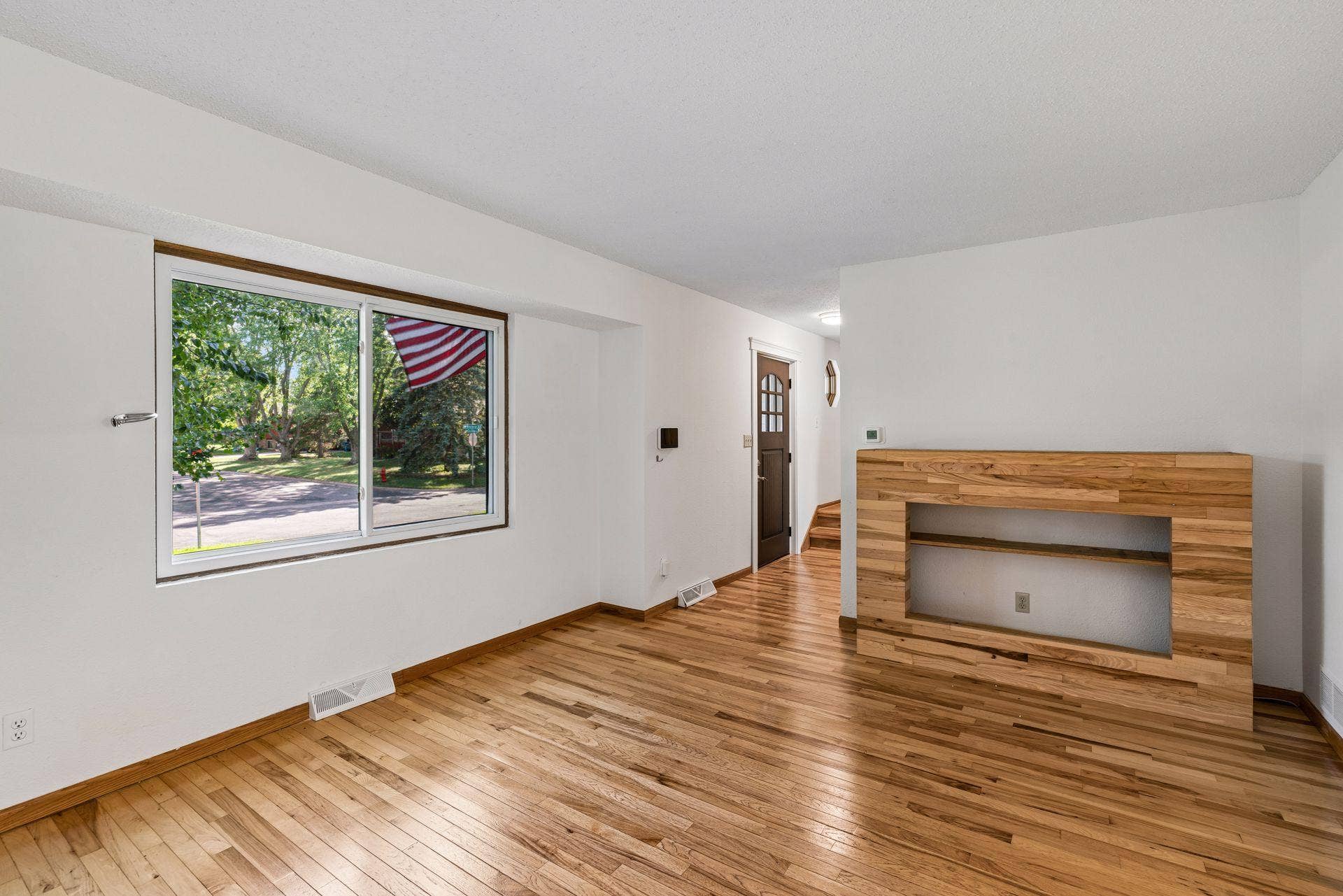 2841 Riviera Drive N, White Bear Lake, MN 55110 Living room with a large front window and natural wood accents.
