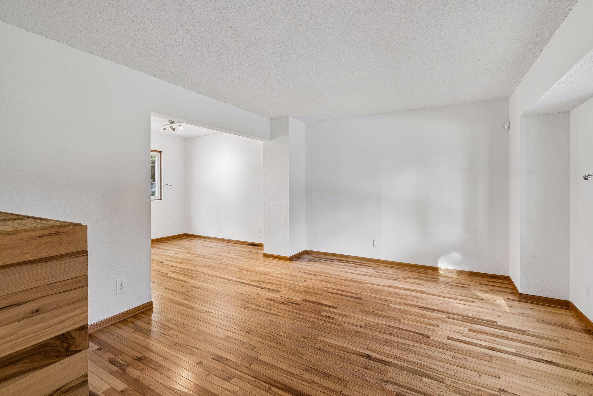 2841 Riviera Drive N, White Bear Lake, MN 55110 Hardwood flooring connects the bright living and dining spaces.