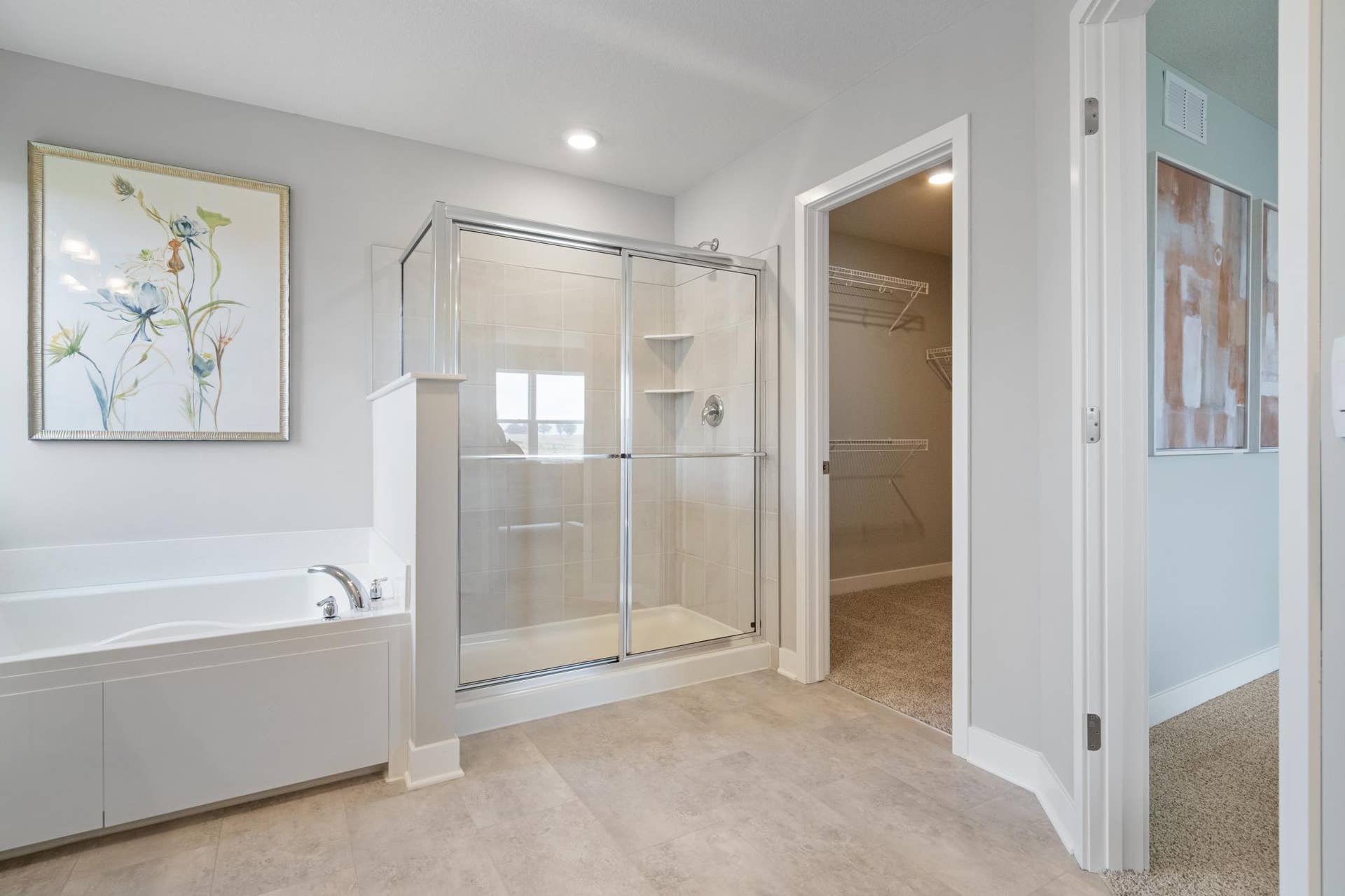 4919 Blake Way, Woodbury, MN 55129 Primary Bathroom with soaking tub and tile shower.