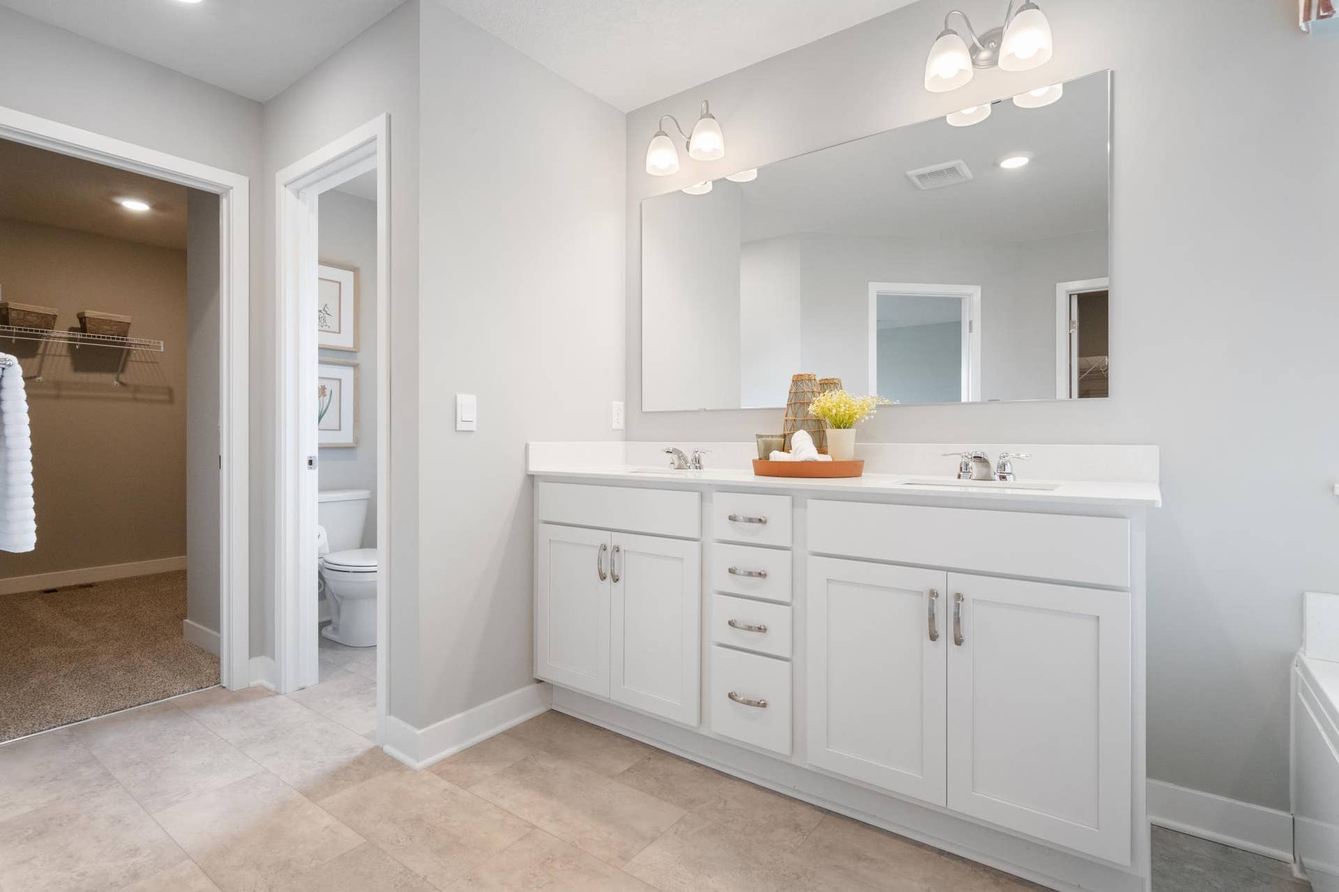 4919 Blake Way, Woodbury, MN 55129 Primary bathroom with 2 sinks, Quartz counters and 2 walk in closets.